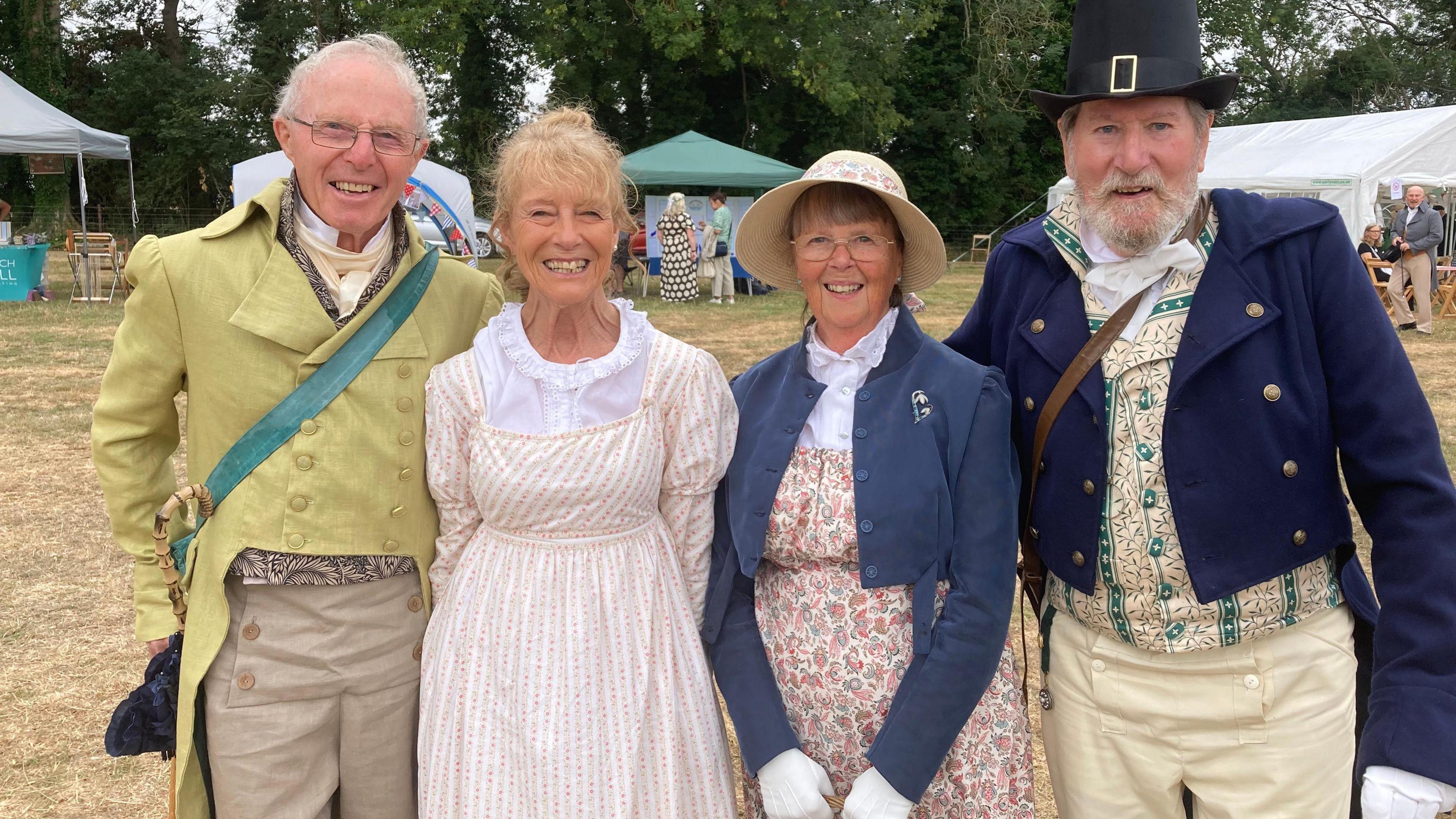Two men and two women in Regency clothes. 