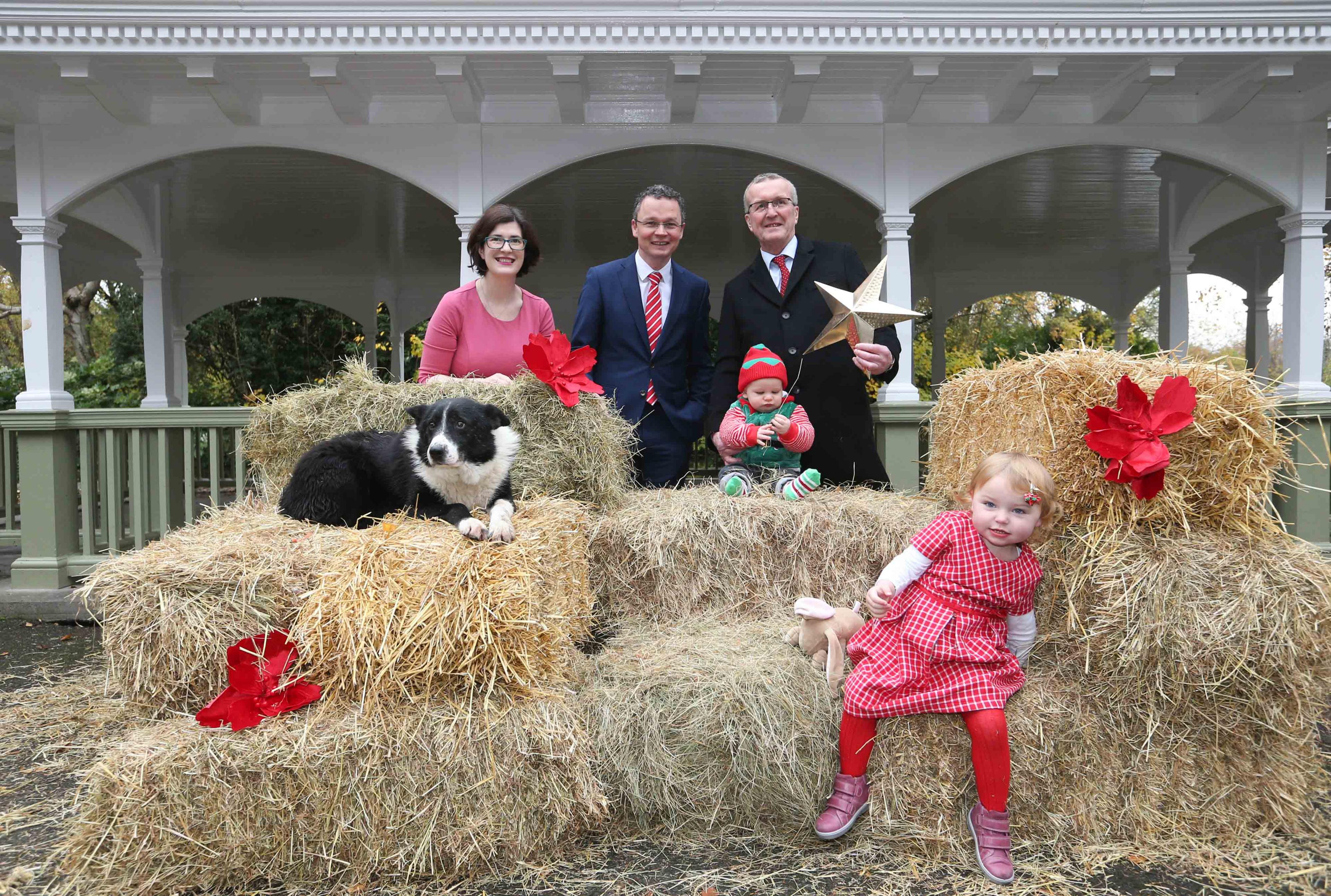 Minister Patrick O'Donovan (centre) posed for photos at the proposed site of the new crib in St Stephen's Green 