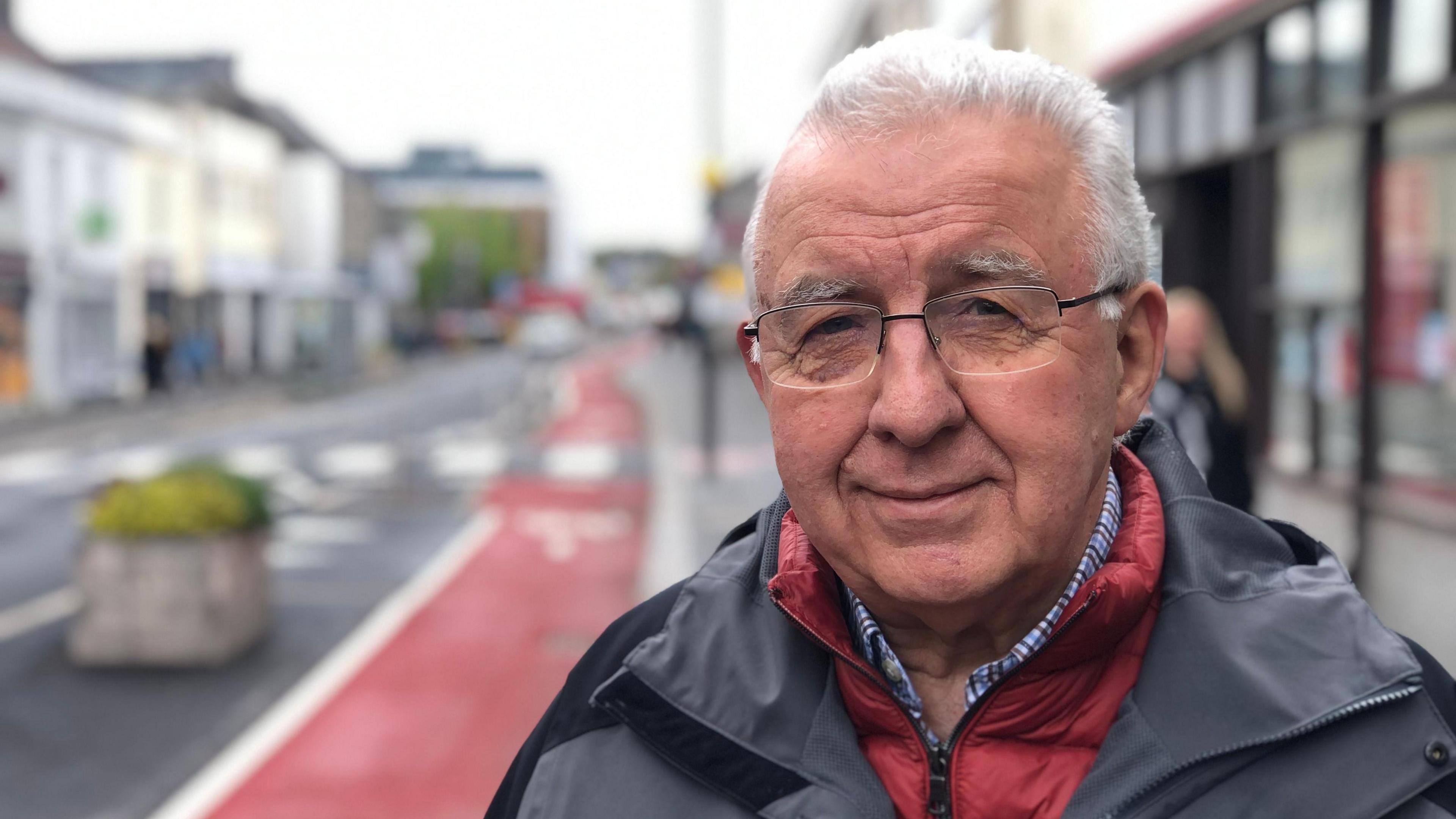 Councillor Alan Hale with Keynsham high street in the background