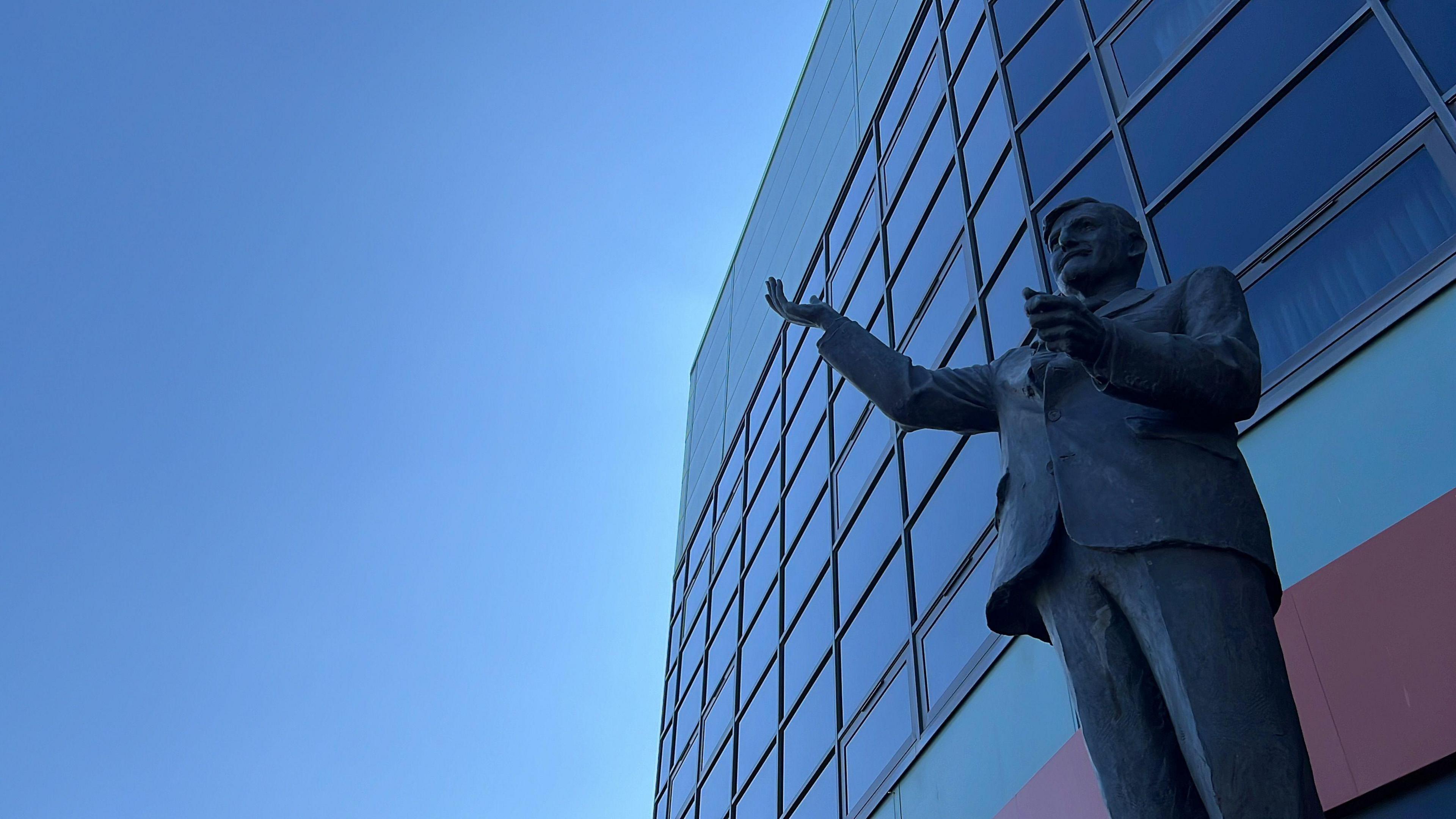 A statue of Jimmy Hill outside the Coventry Building Society Arena