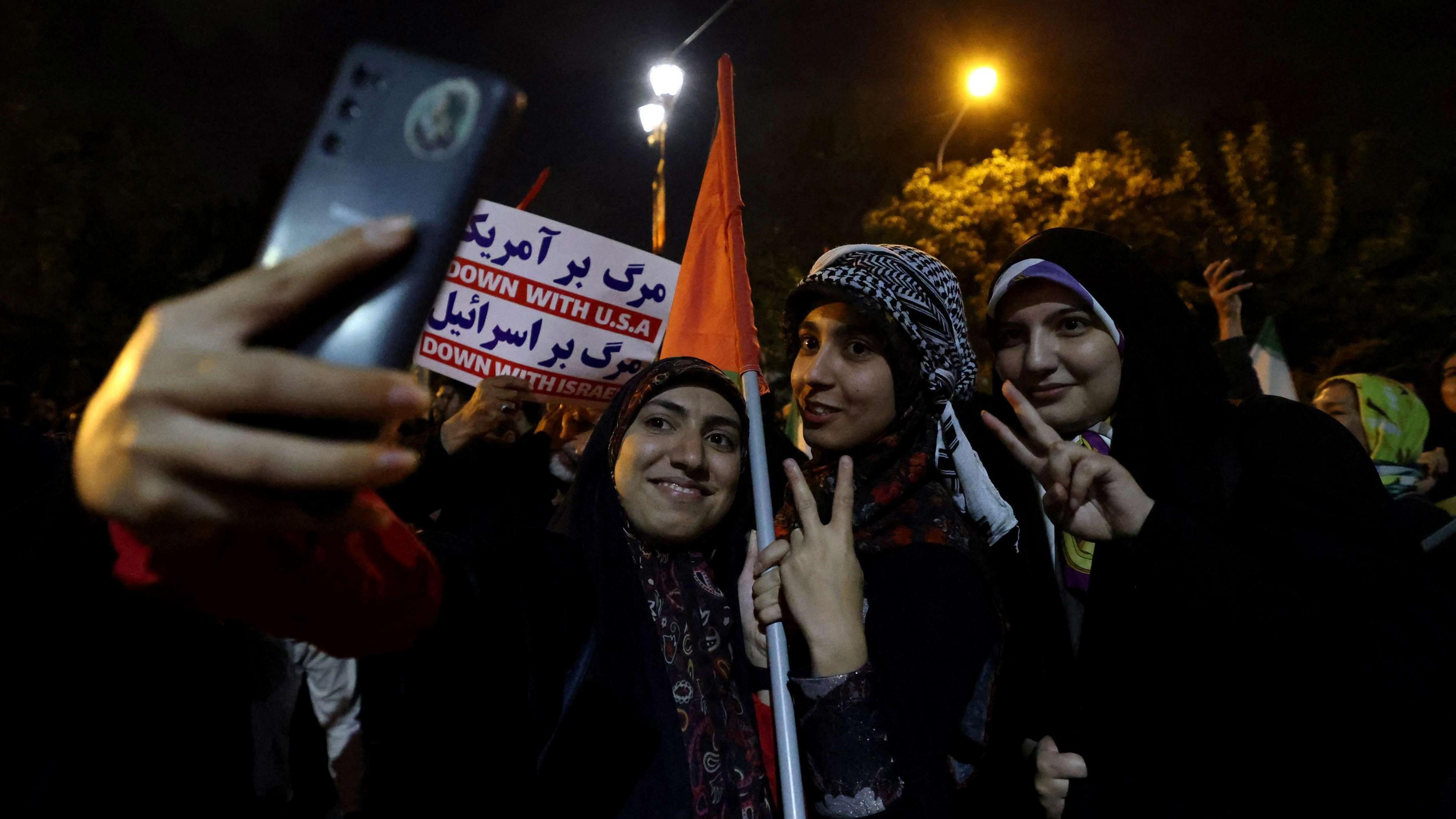 Iranian women celebrate on the streets of Tehran