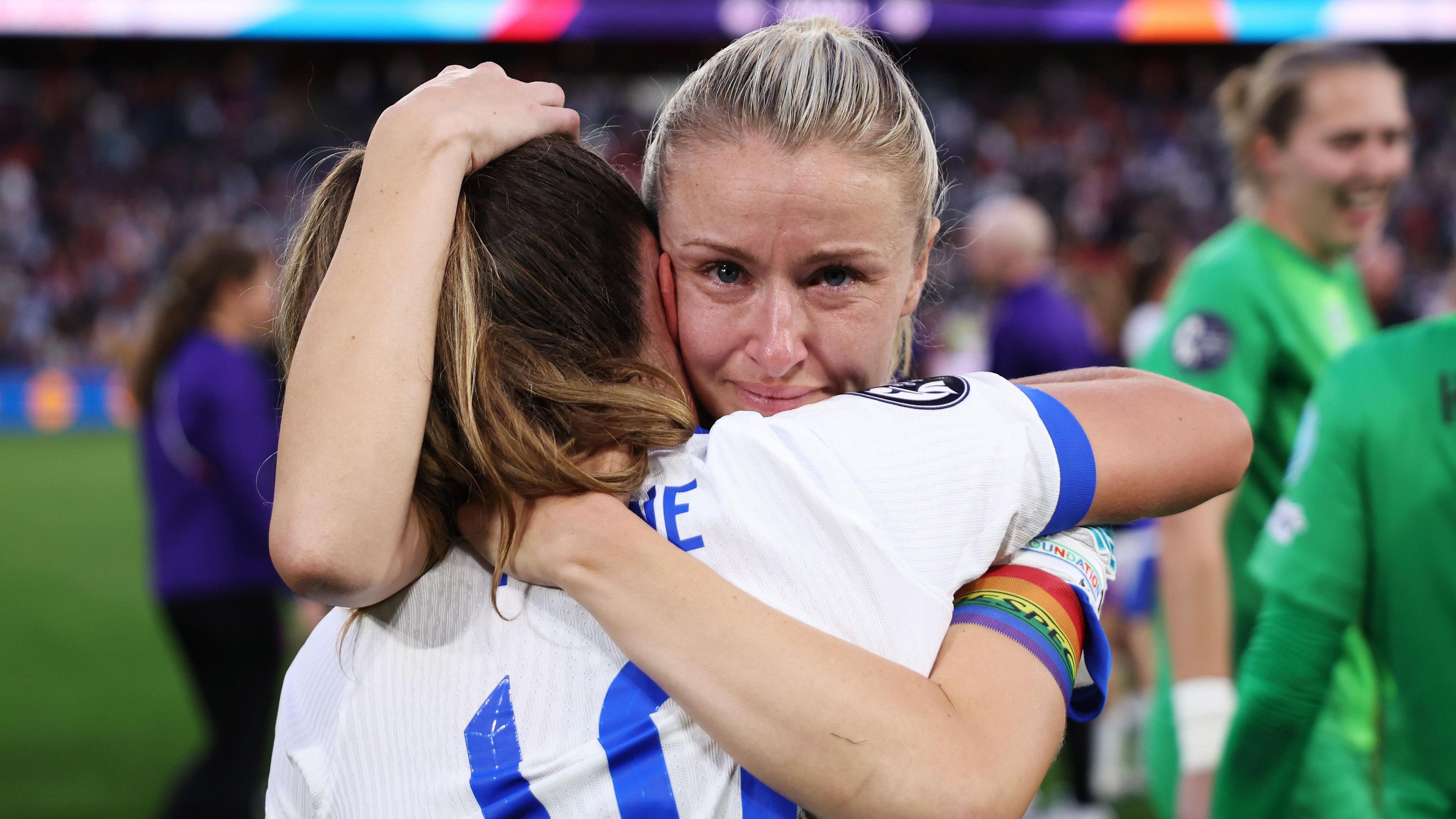 Leah Williamson hugs Ella Toone after beating Spain on penalties