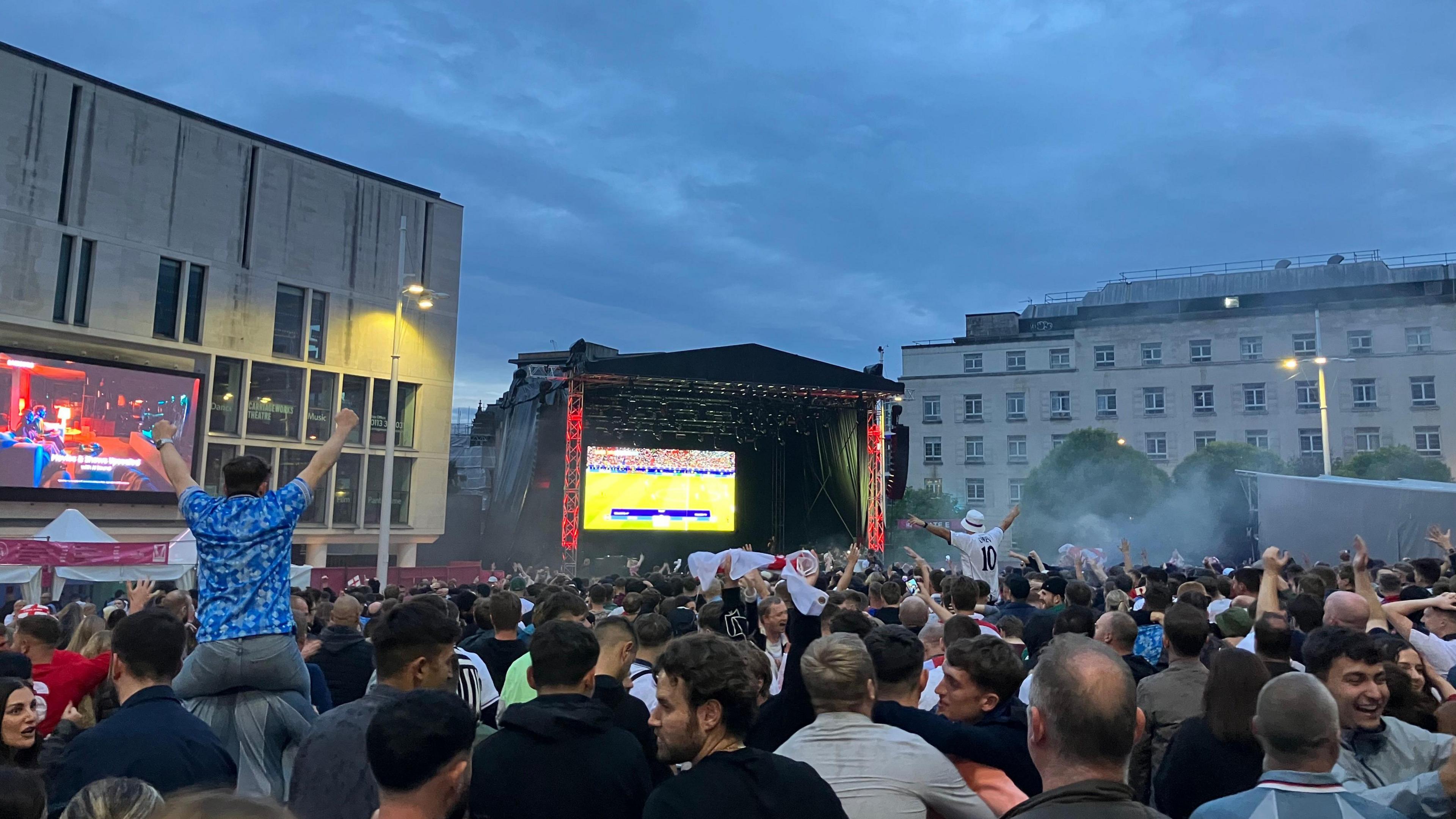 A photo of the England fans in Millenium Square