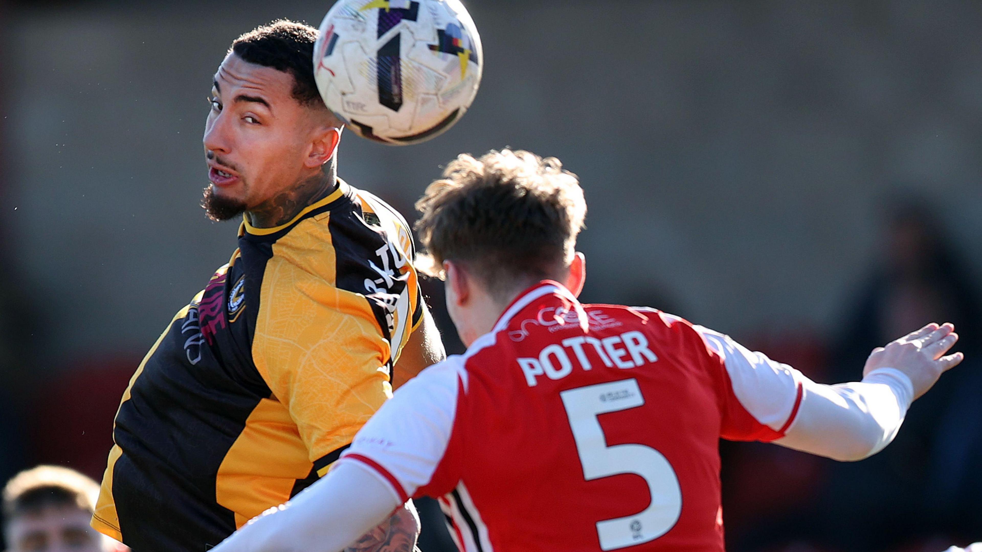 Courtney Baker-Richardson of Newport (left) and Finley Potter of Fleetwood