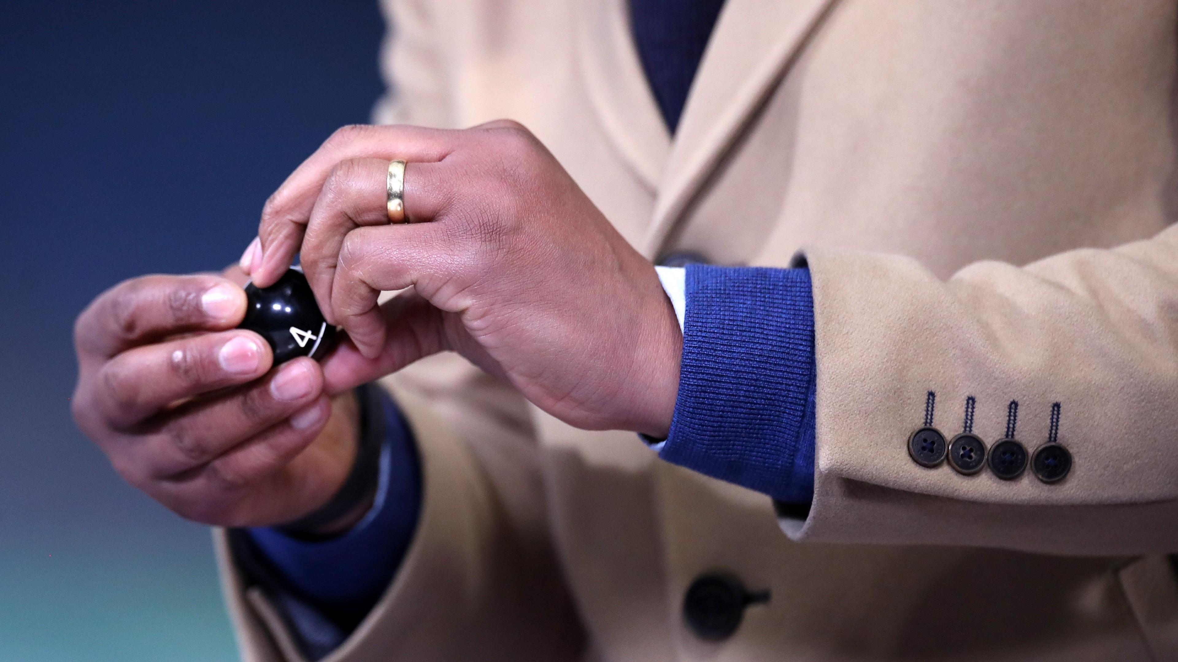 Dion Dublin picks out a ball during the FA Cup semi-final draw in 2021