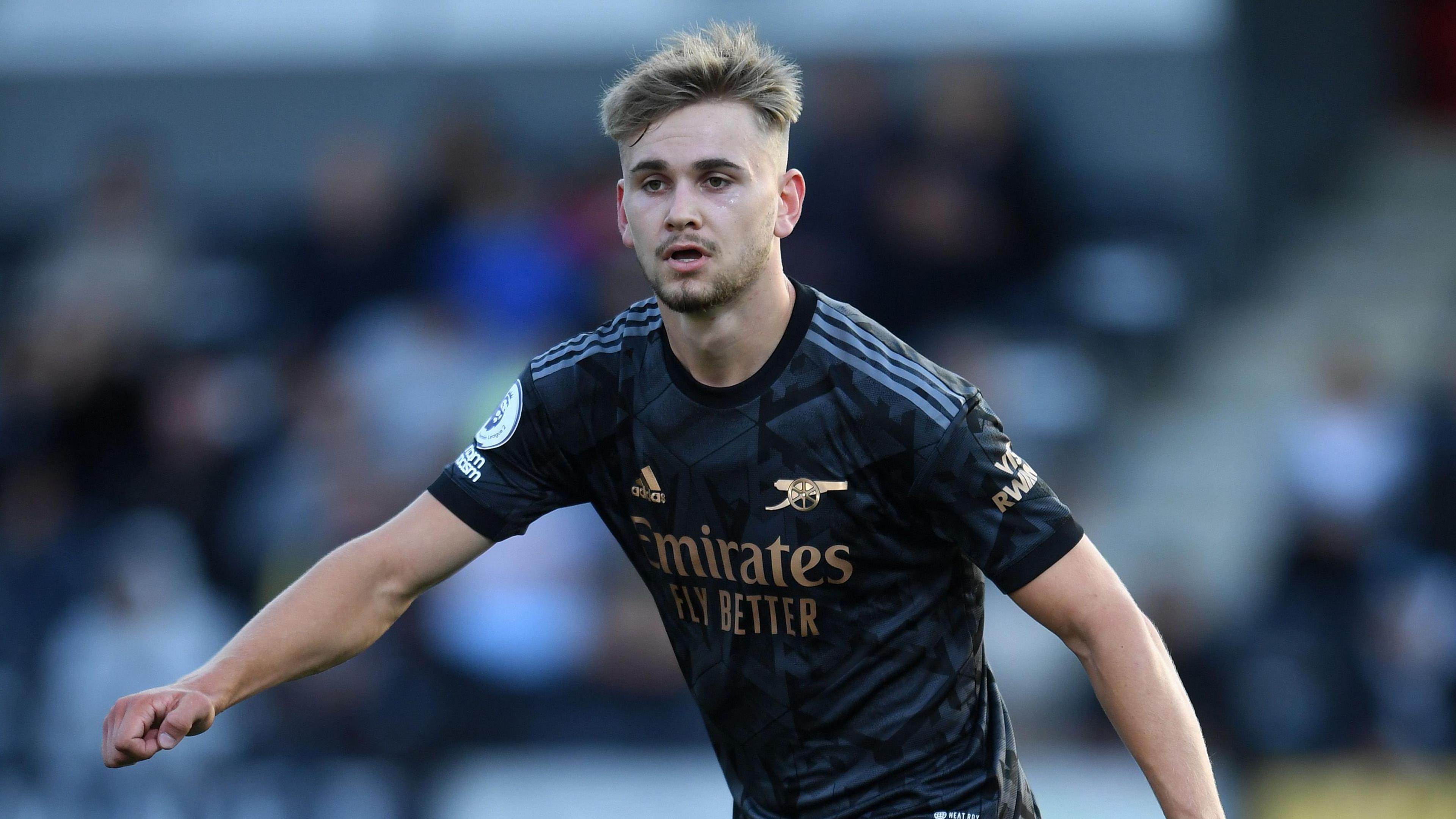 Billy Vigar, a young man with short blonde hair, playing for Arsenal