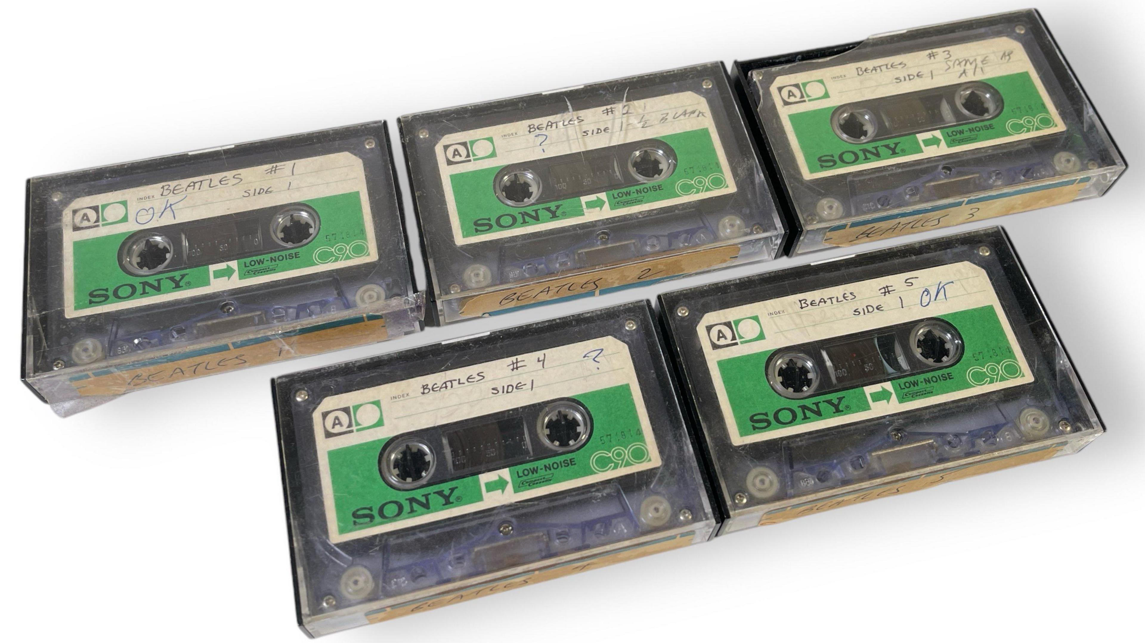 Five Sony cassette tapes with green labels and numbered in order with a hand-written note saying 'Beatles'