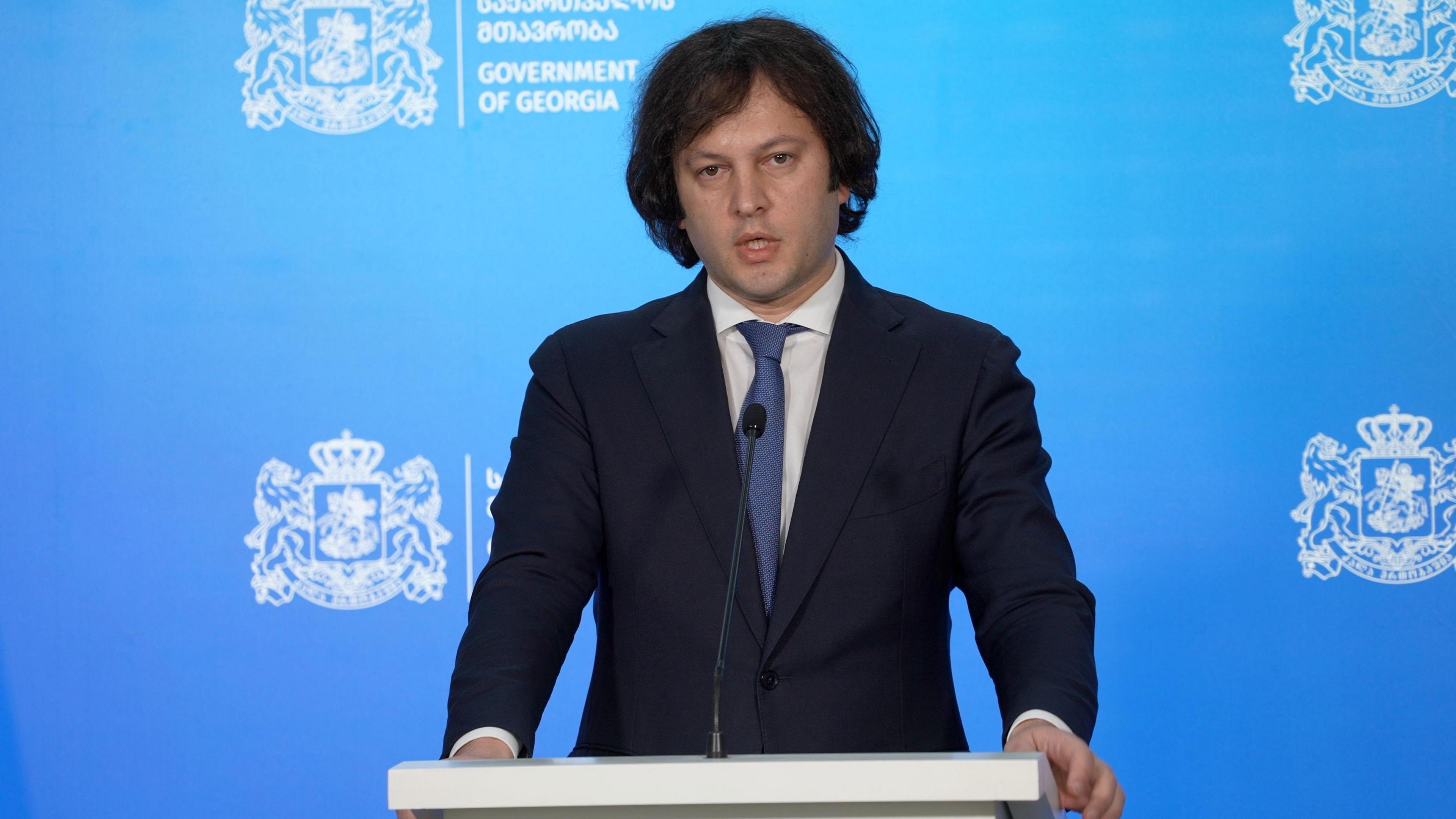 Irakli Kobakhidze, Georgian prime minister, gives a press conference at a lectern in Tbilisi