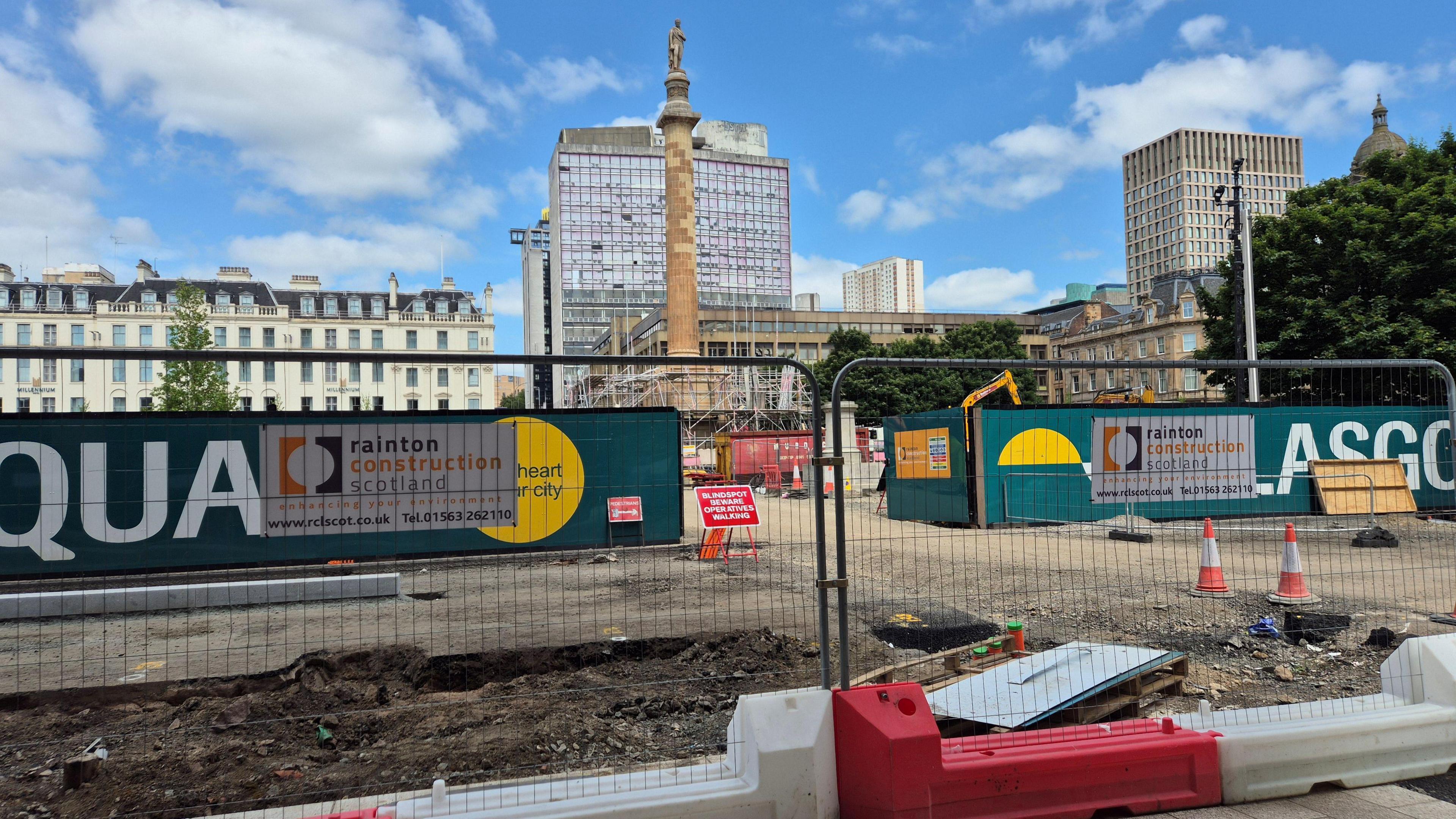 Fencing, signs and cones around the entrance to George Square, with most of the ground having been dug up