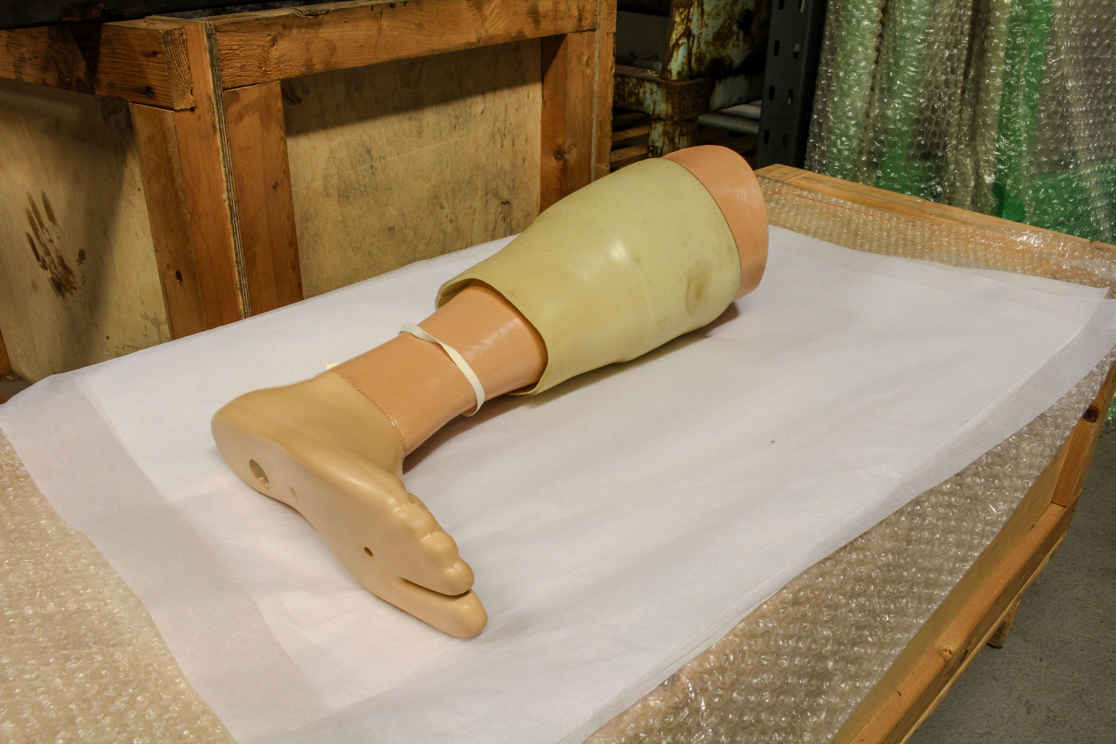 A prosthetic leg laying on a table 