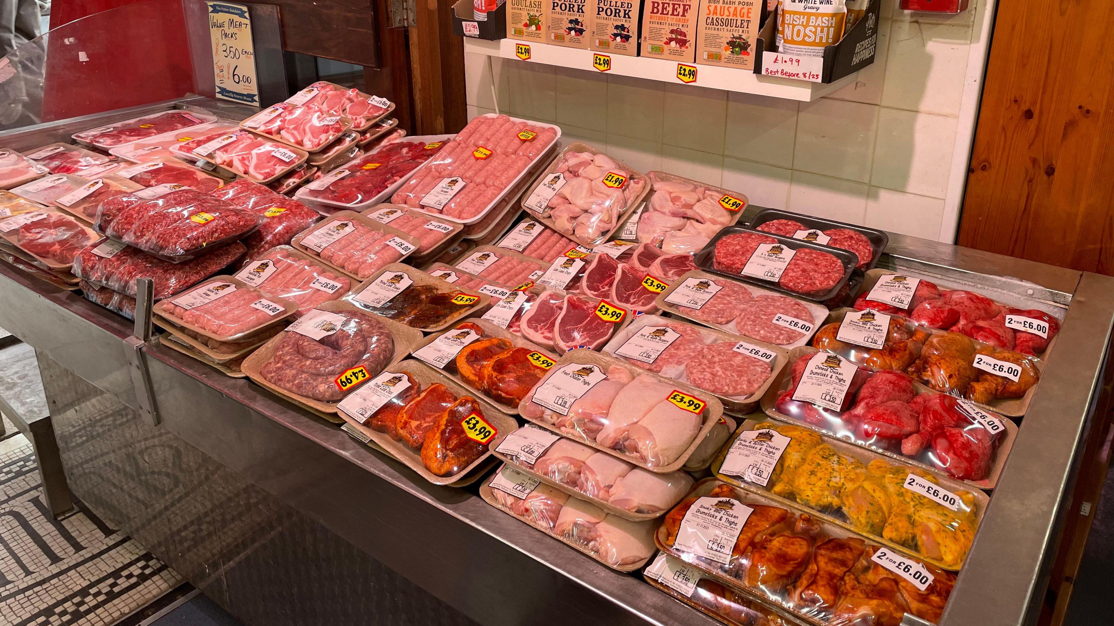 A counter full of pre-packed meat