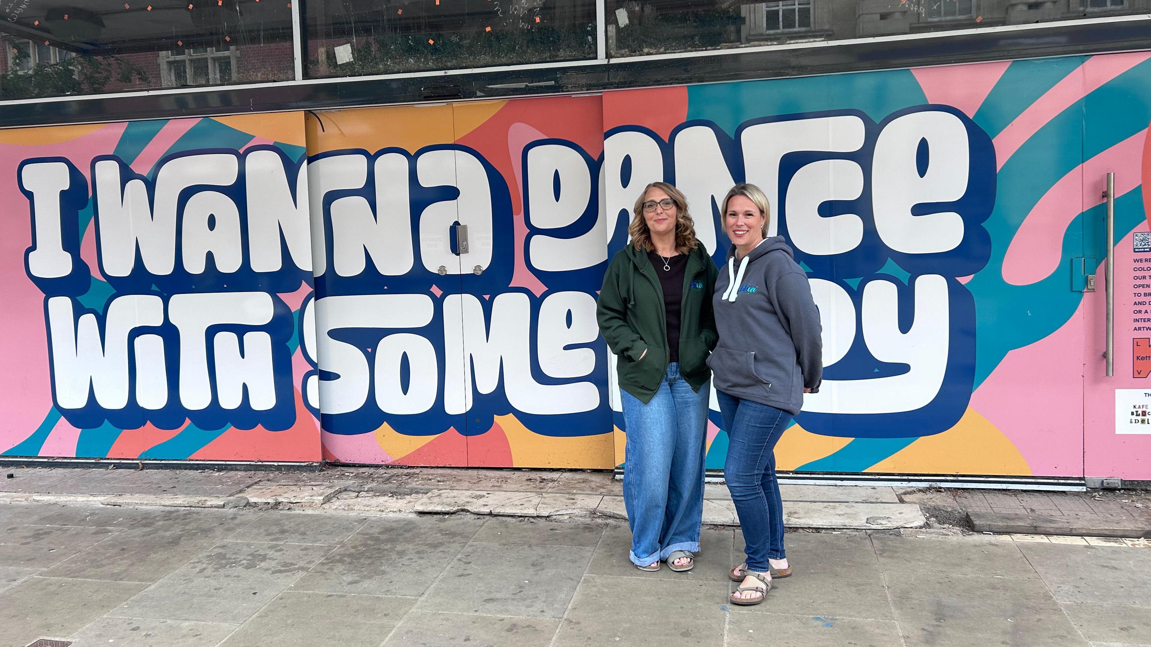 Lindsey Atkins and Beccy Hurrel stand side-by-side outside the former bingo hall in Kettering.