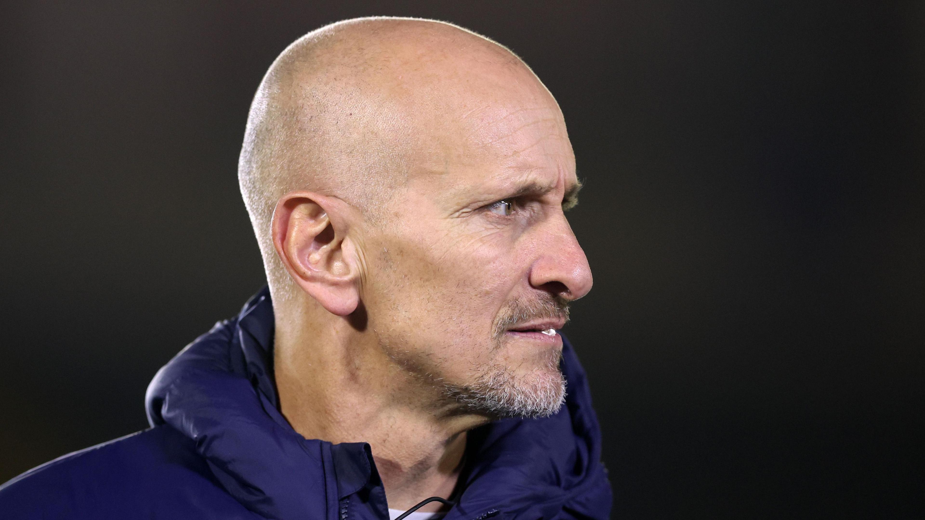 Alan Dickens with his head turned to the right