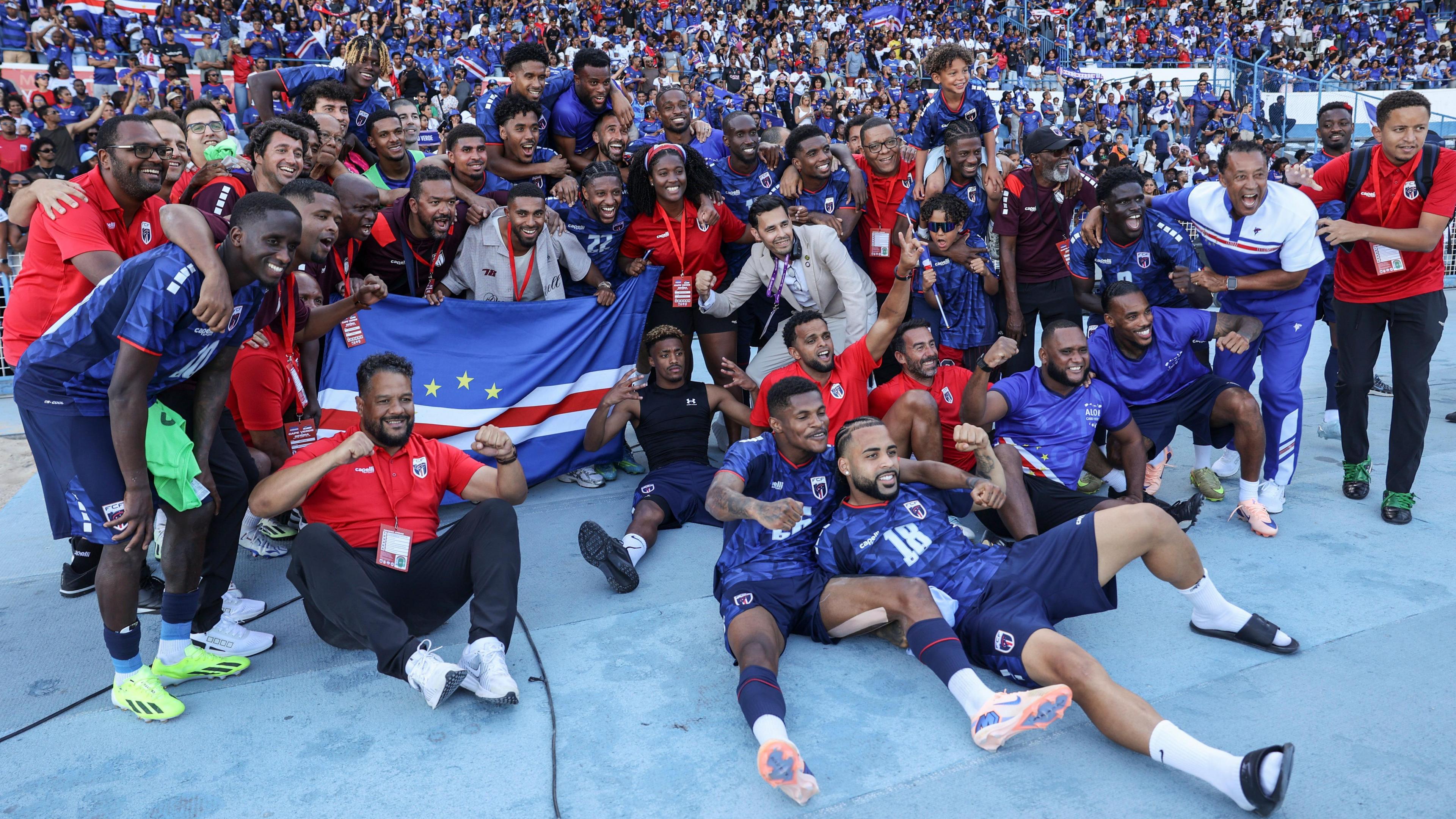 Cape Verde squad posing for a picture in front of their own fans in the stadium