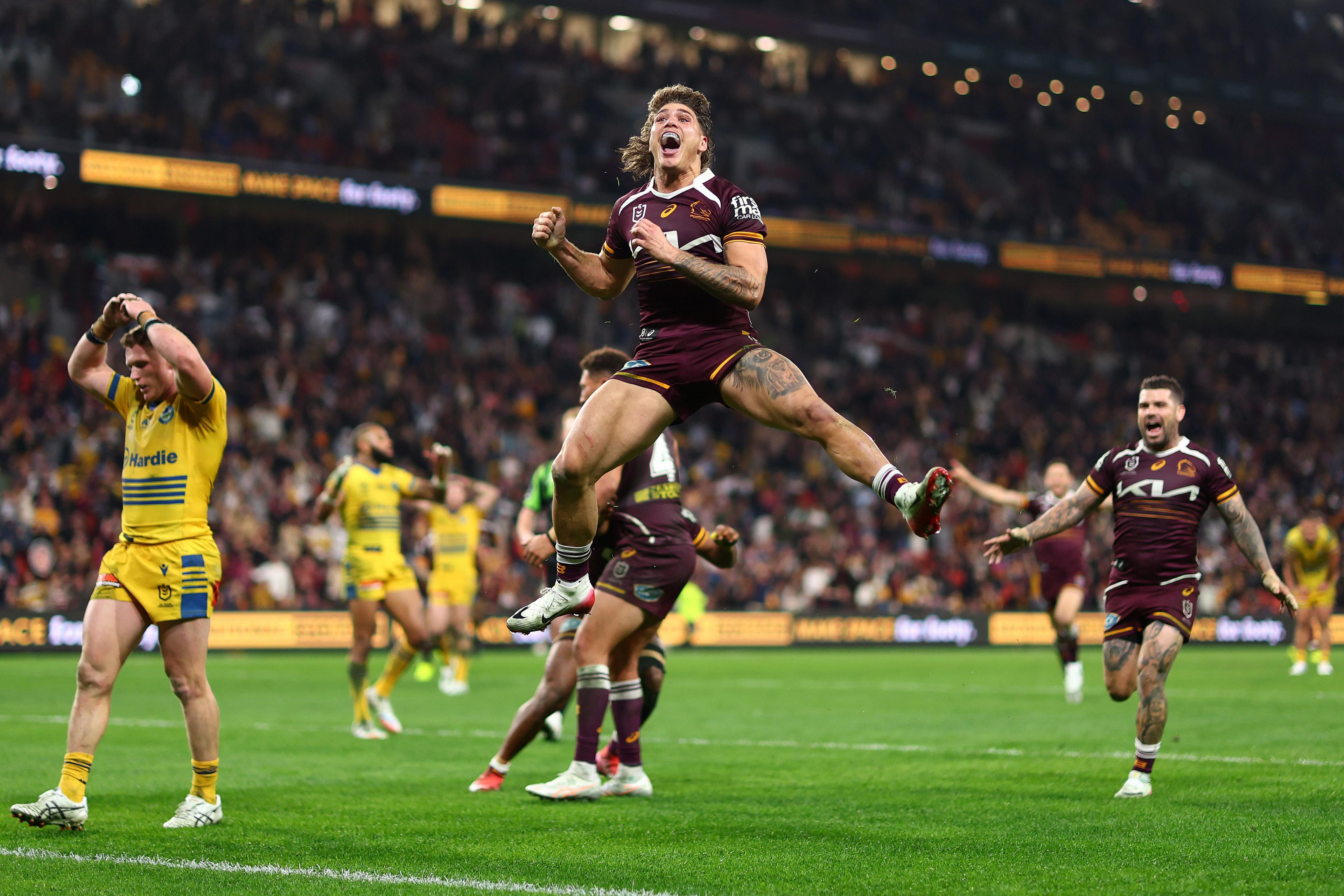 Reece Walsh of the Brisbane Broncos celebrates scoring a last-minute try against the Paramatta Eels by leaping into the air at Suncorp Stadium, only for it to be disallowed for offside. Photo by Chris Hyde
