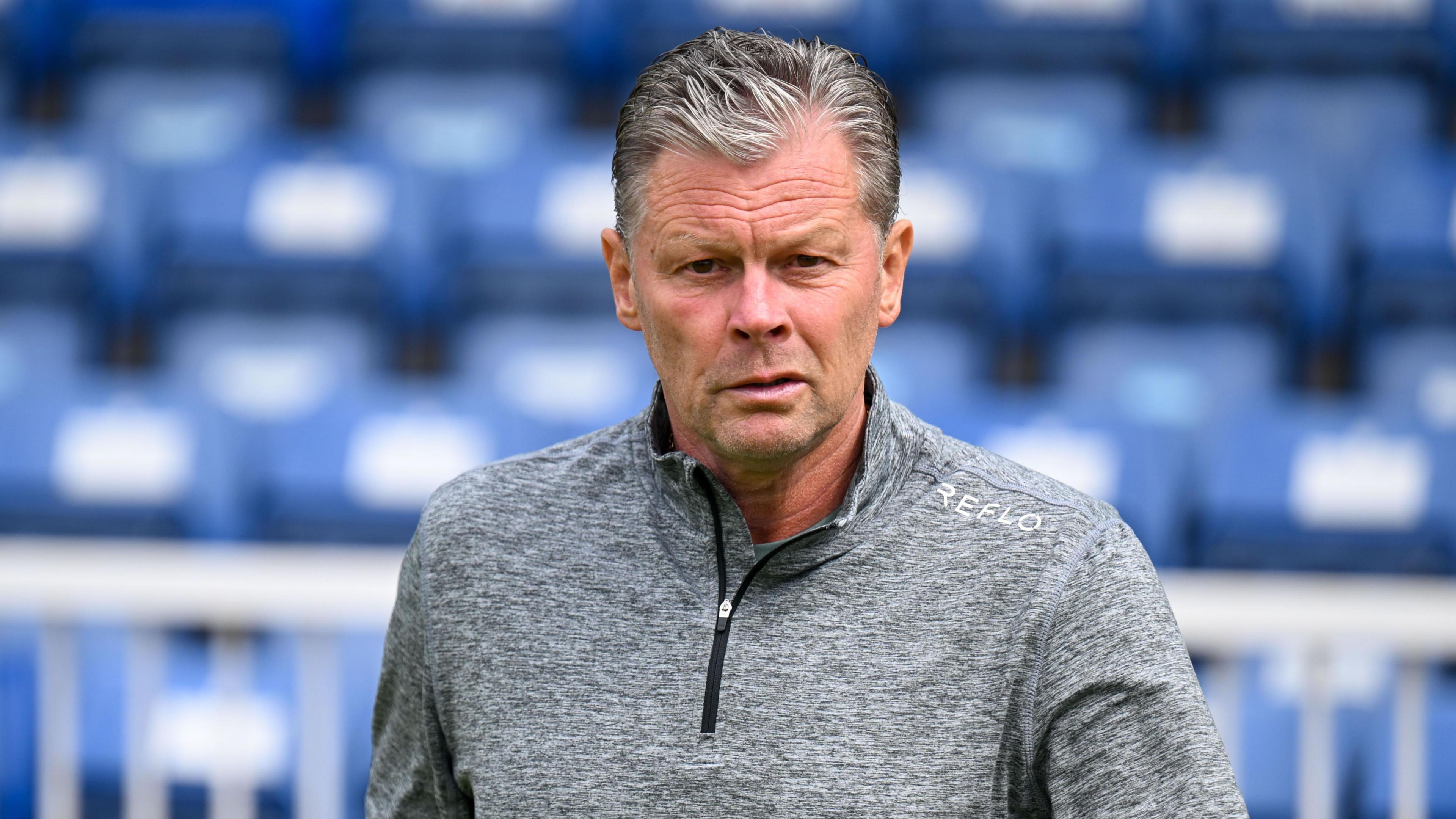 Steve Cotterill walking on the side of the pitch while manager of Forest Green Rovers.