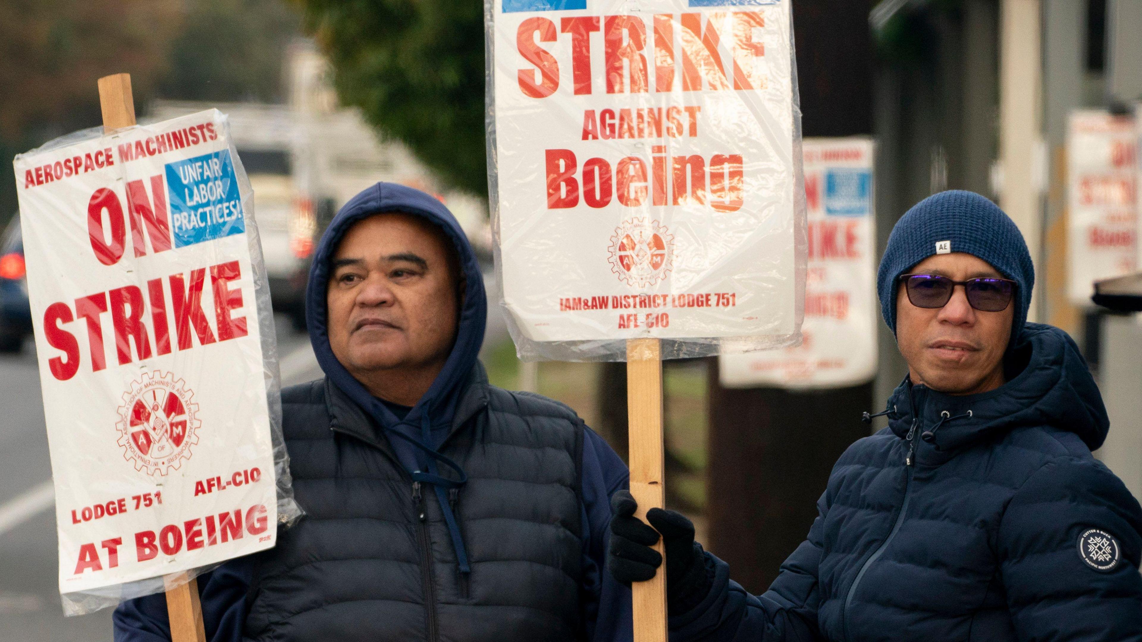 Boeing workers on a picket line near the entrance to a Boeing facility in Seattle, Washington. 