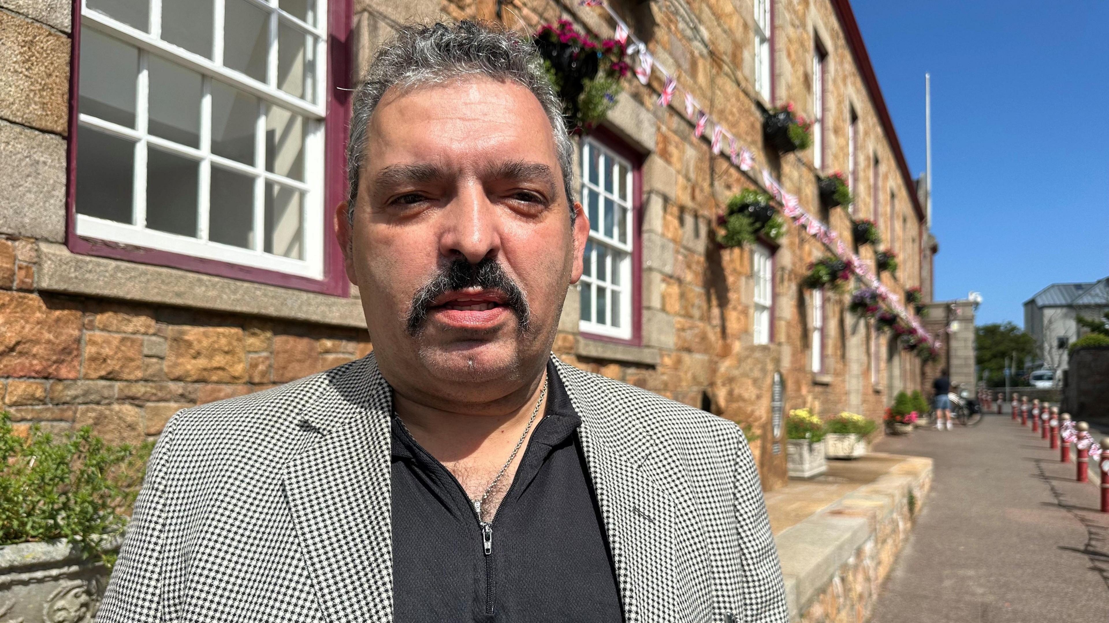 Honorary police officer outside St Peter's Parish Hall