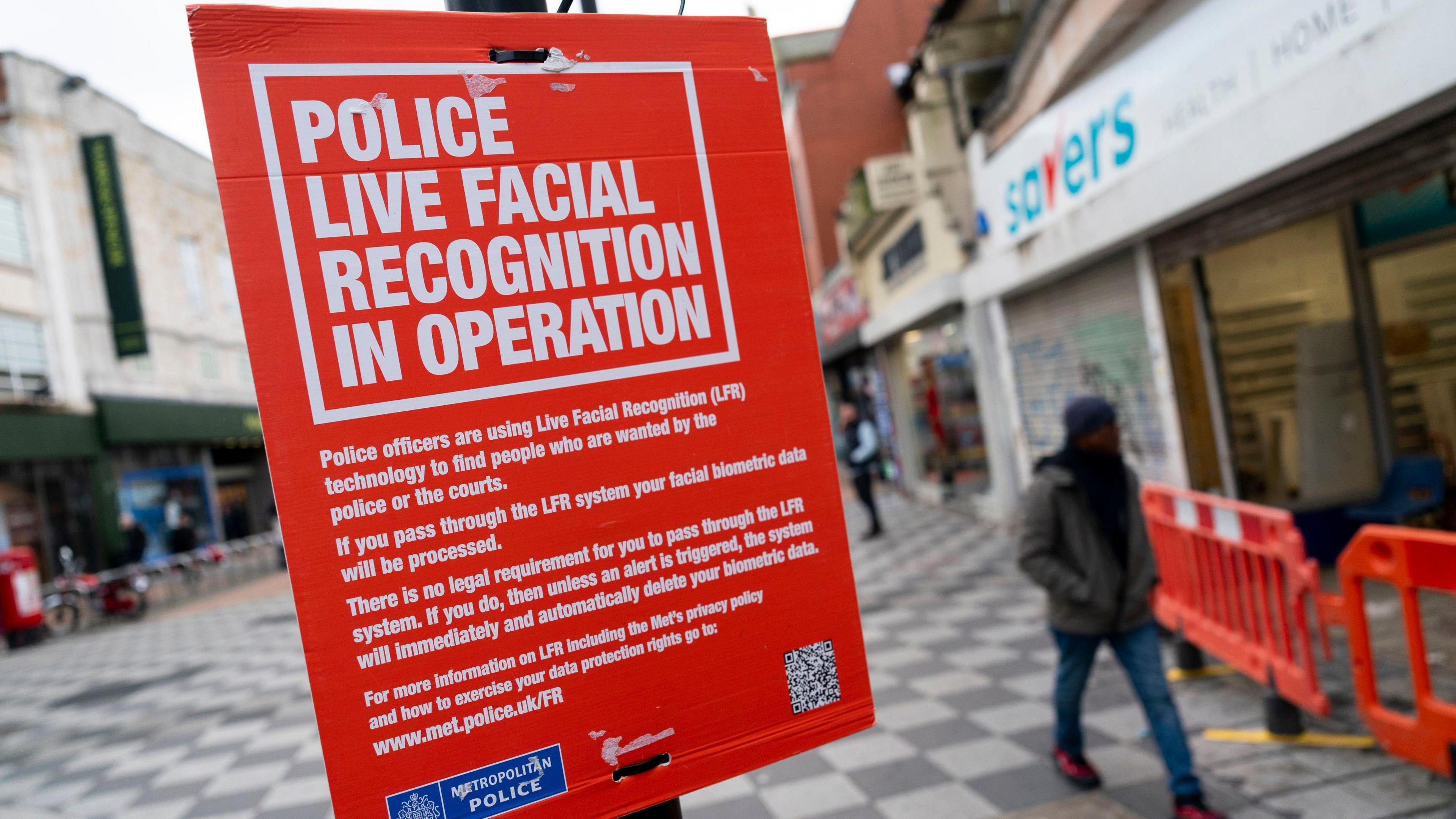A police sign stating: Police live facial recognition in operation.
