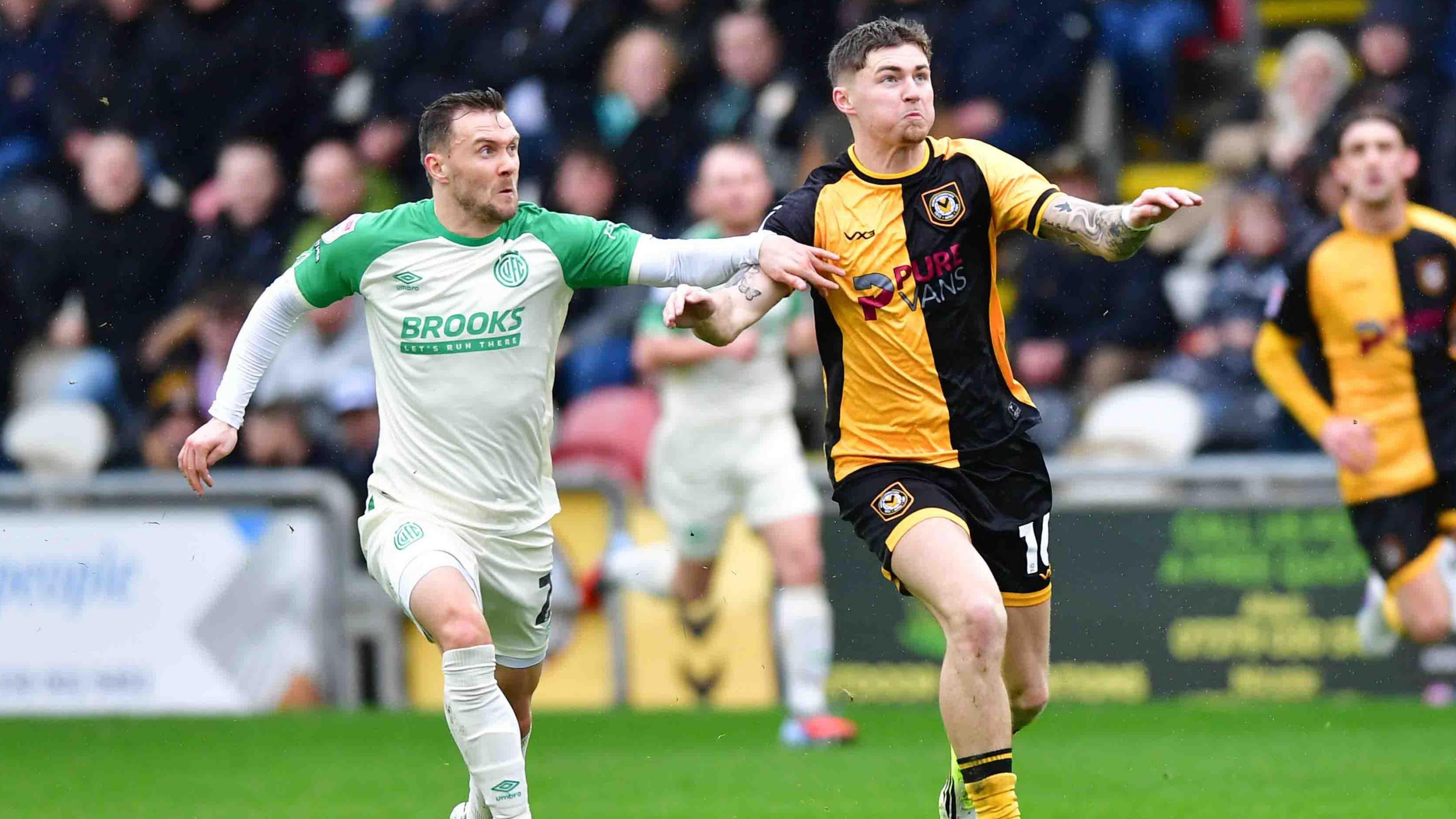 Shane McLoughlin of Cambridge United and James Crole of Newport County
