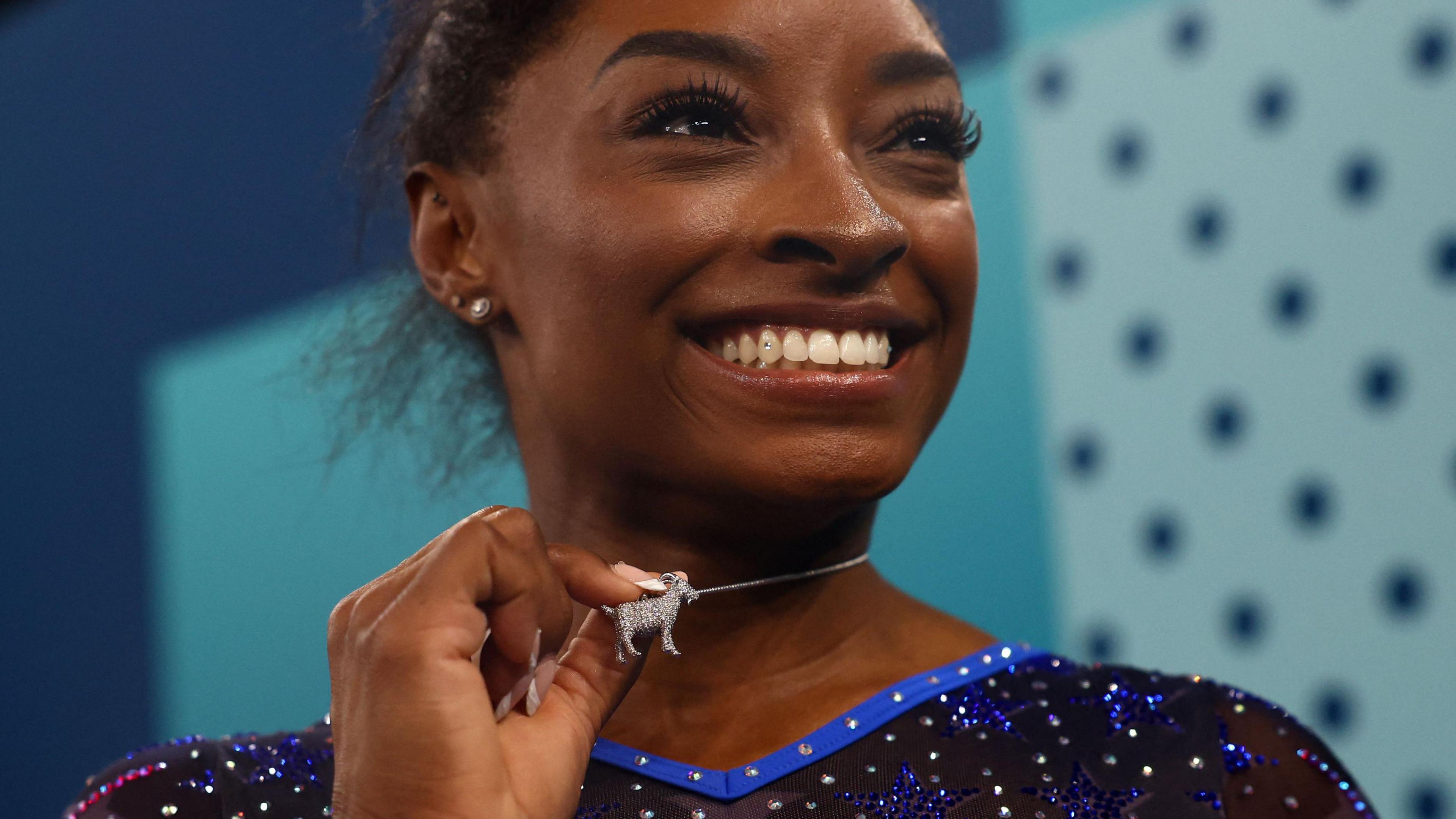 simone biles with goat necklace