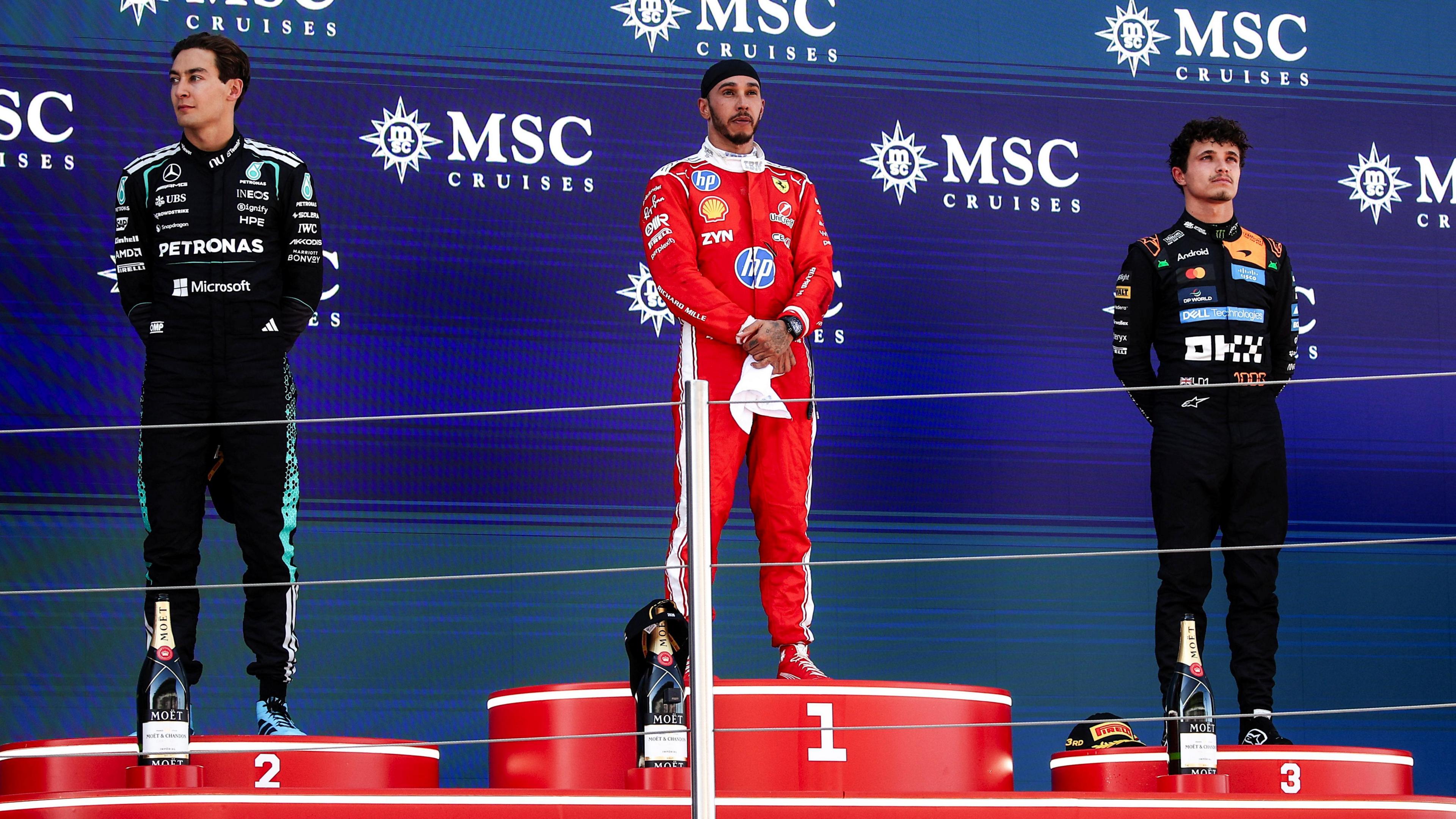 Mercedes' George Russell, Ferrari's Lewis Hamilton and McLaren's Lando Norris on the podium after the Barcelona-Catalunya Grand Prix