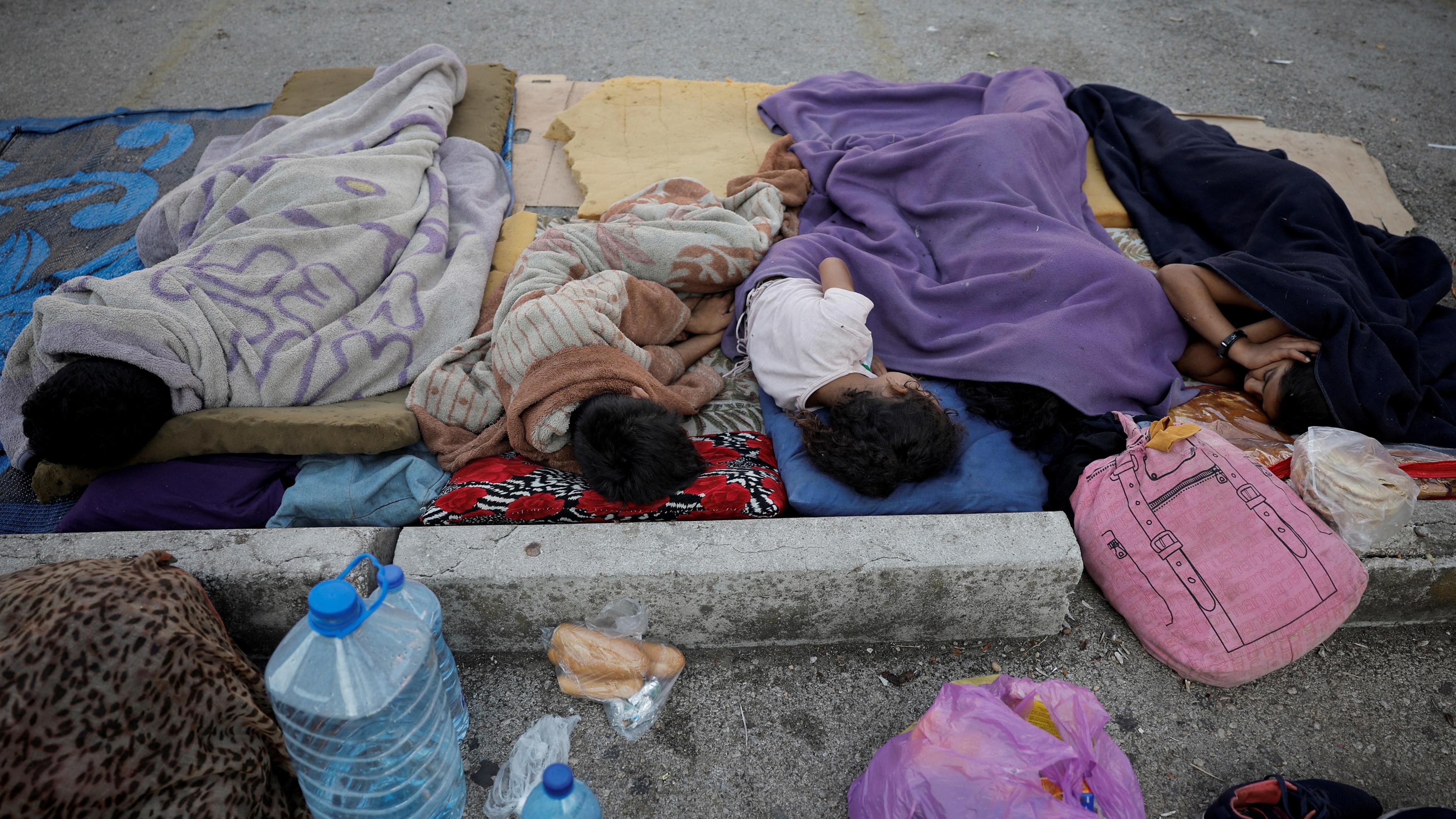 Displaced children sleep in a car park in central Beirut, Lebanon (8 October 2024)