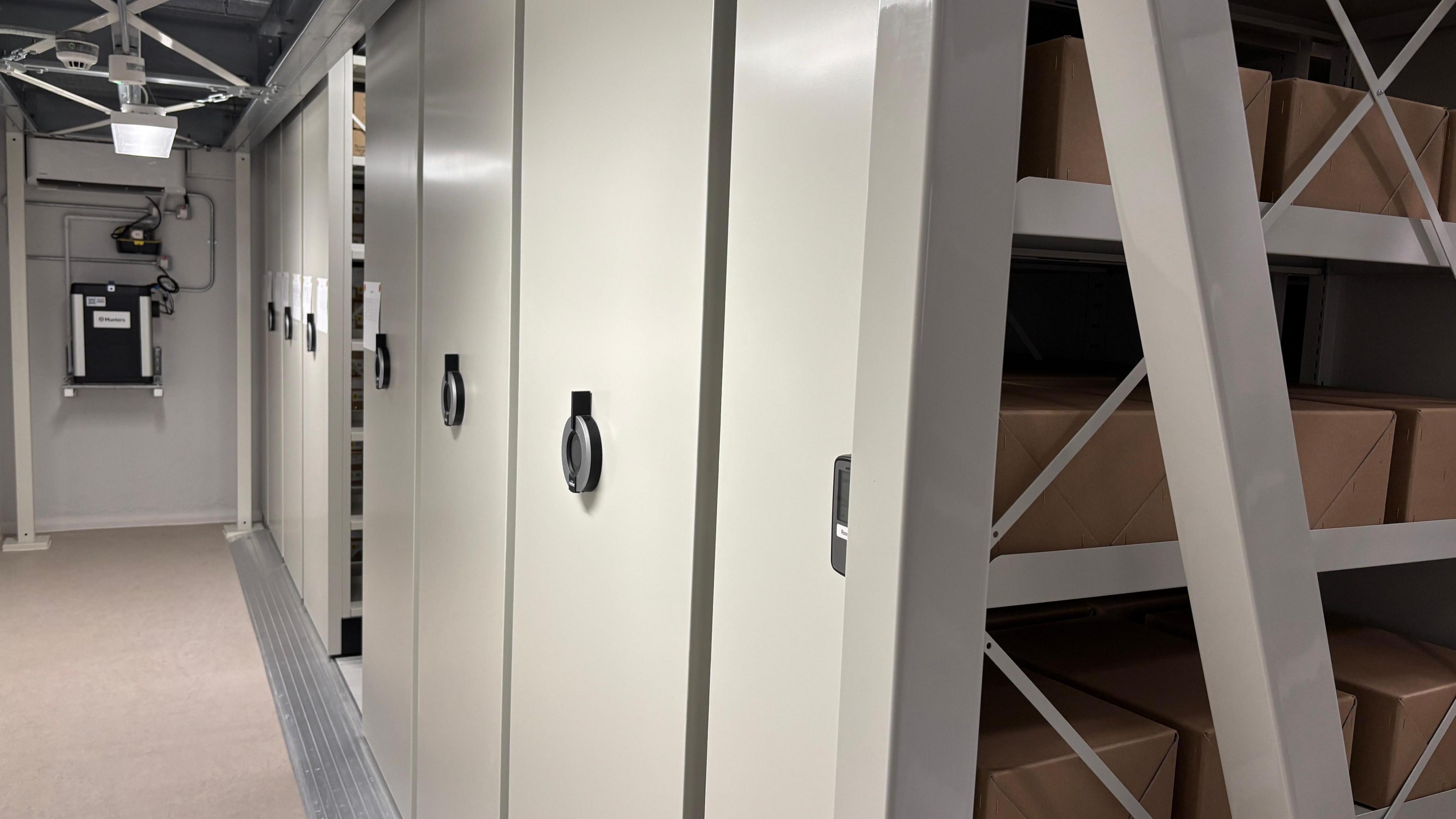 Grey filing cabinets in an underground part of a building