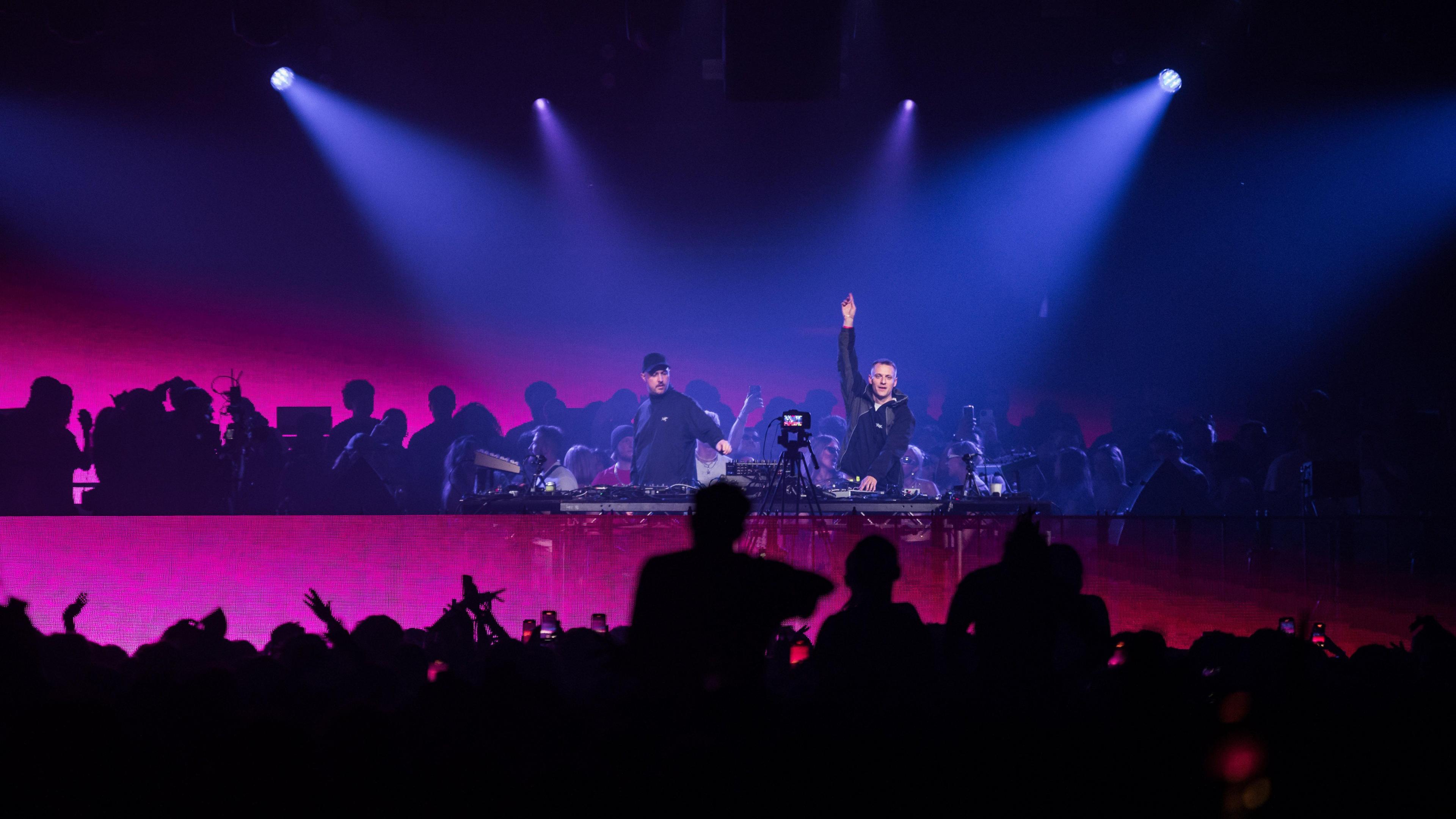 A dj performing to a crowd