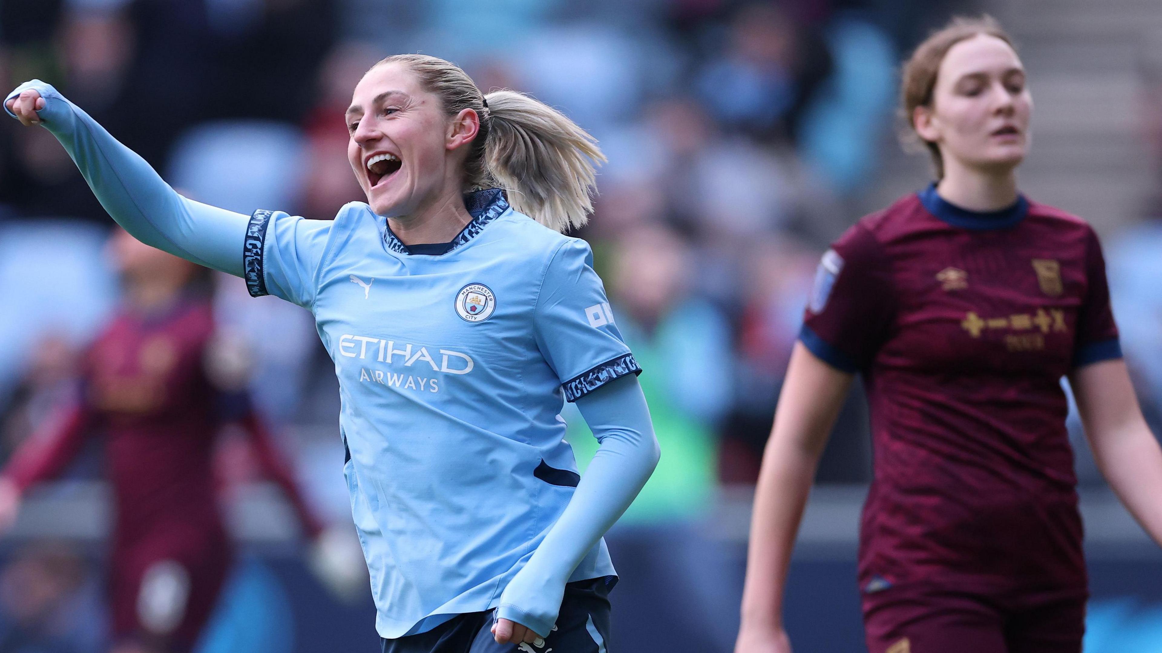 Laura Coombs celebrating scoring a goal for Manchester City