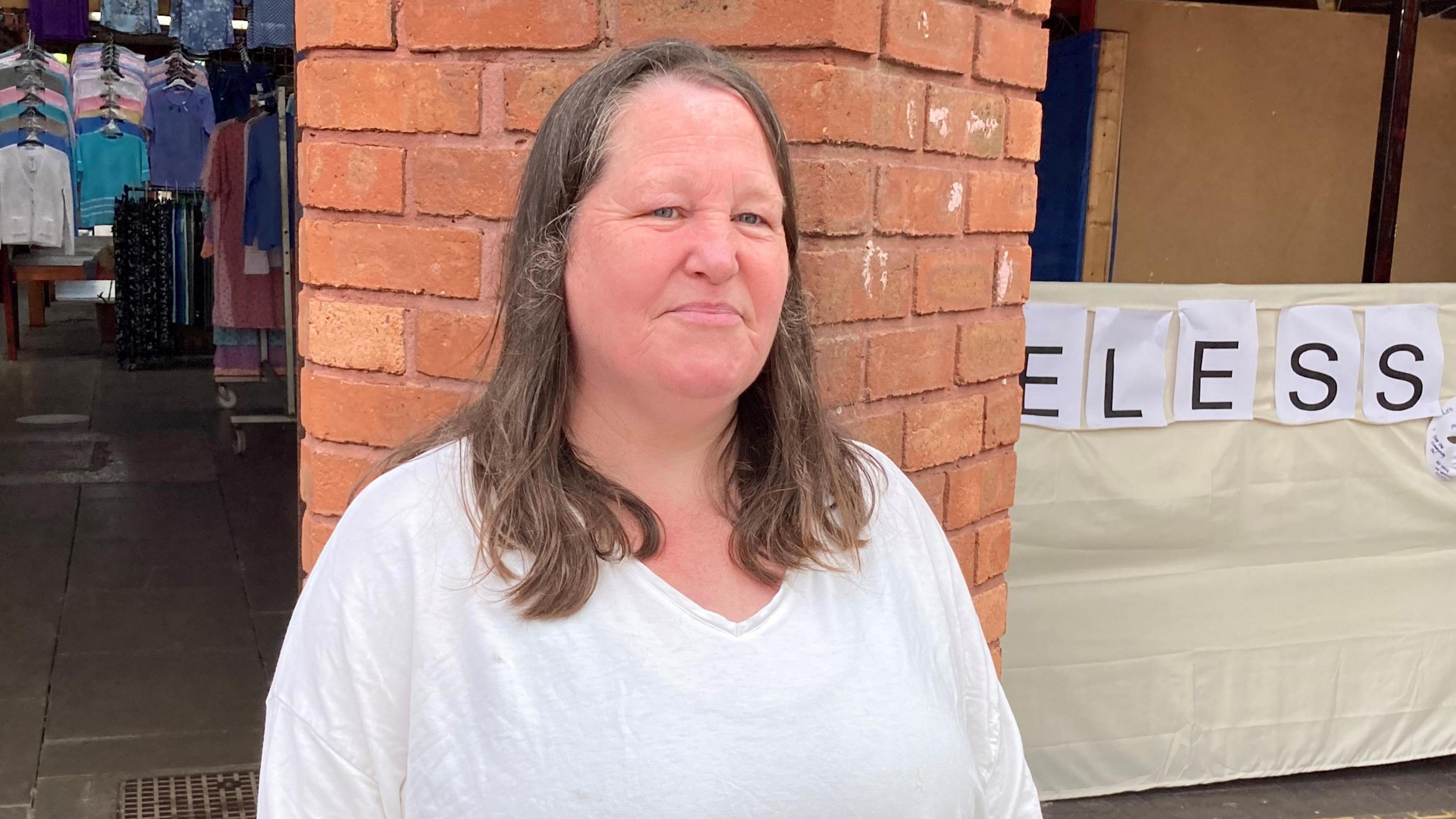 Rachel Scott standing outside Birkenhead Market 