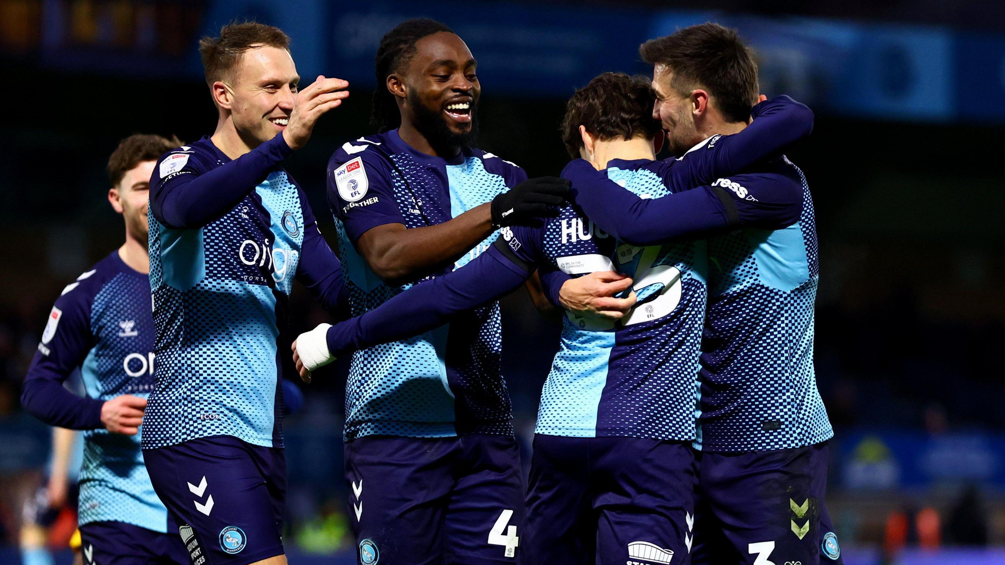 Wycombe players celebrate a goal