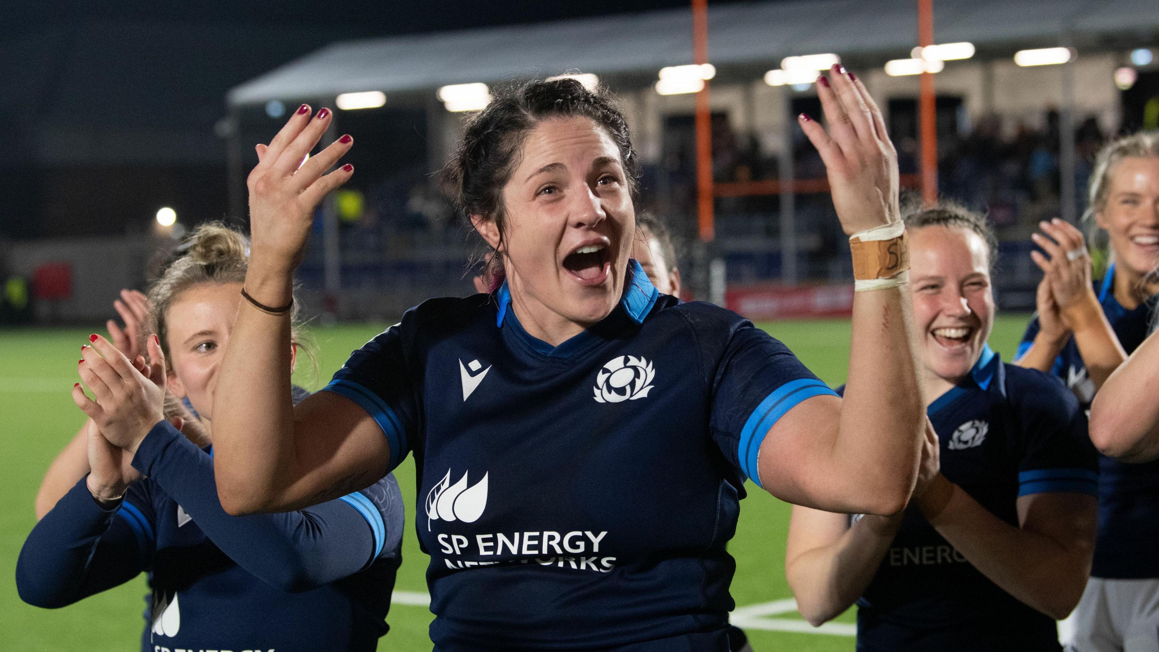 Christine Belisle (centre) celebrates after a Scotland match