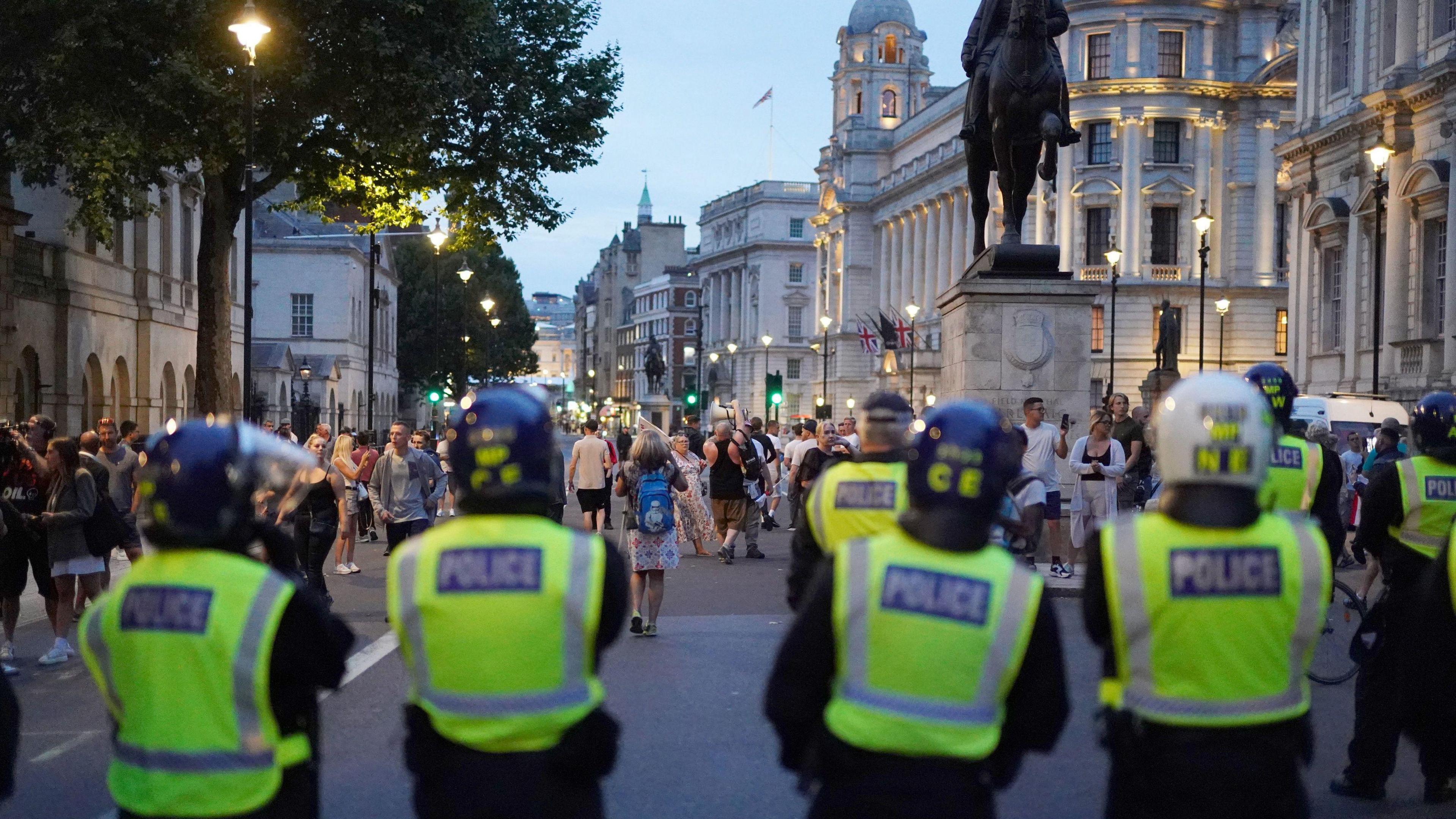 Police line facing demonstrators on Whitehall on 31 July