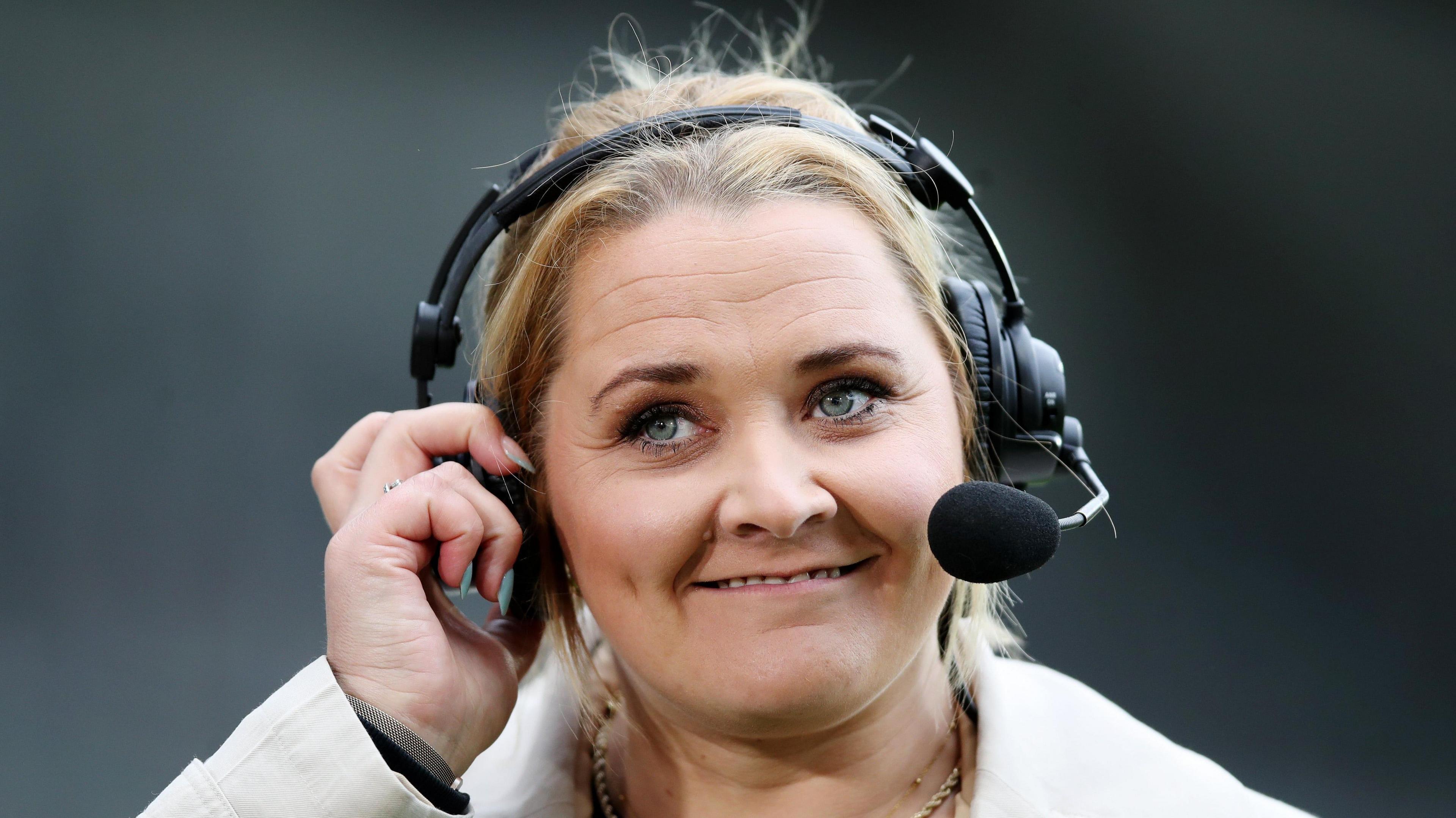 Danika Priim, a woman in her forties, with blonde hair. She is wearing a headset and smiling.