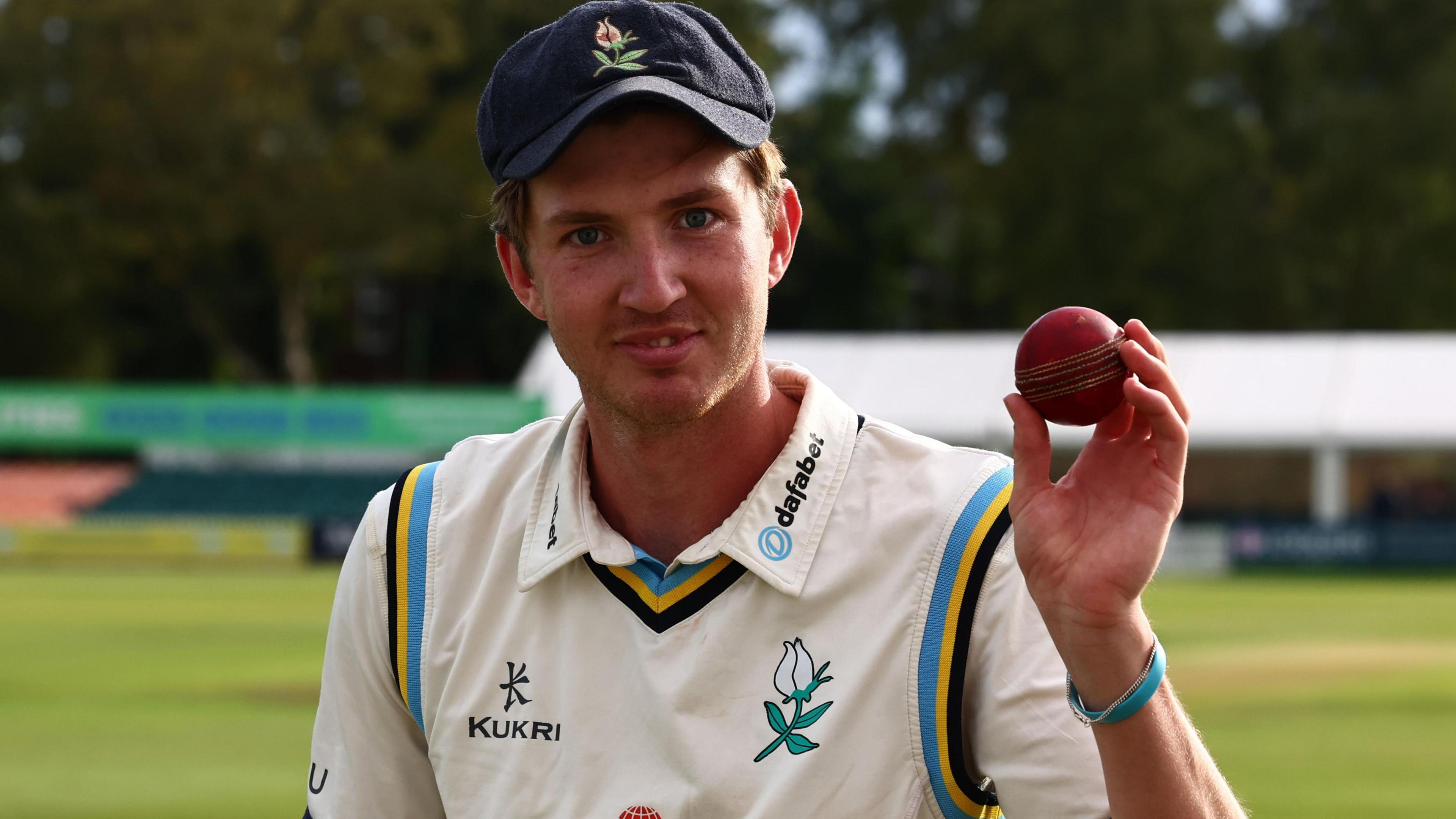 George Hill with the match ball at Grace Road