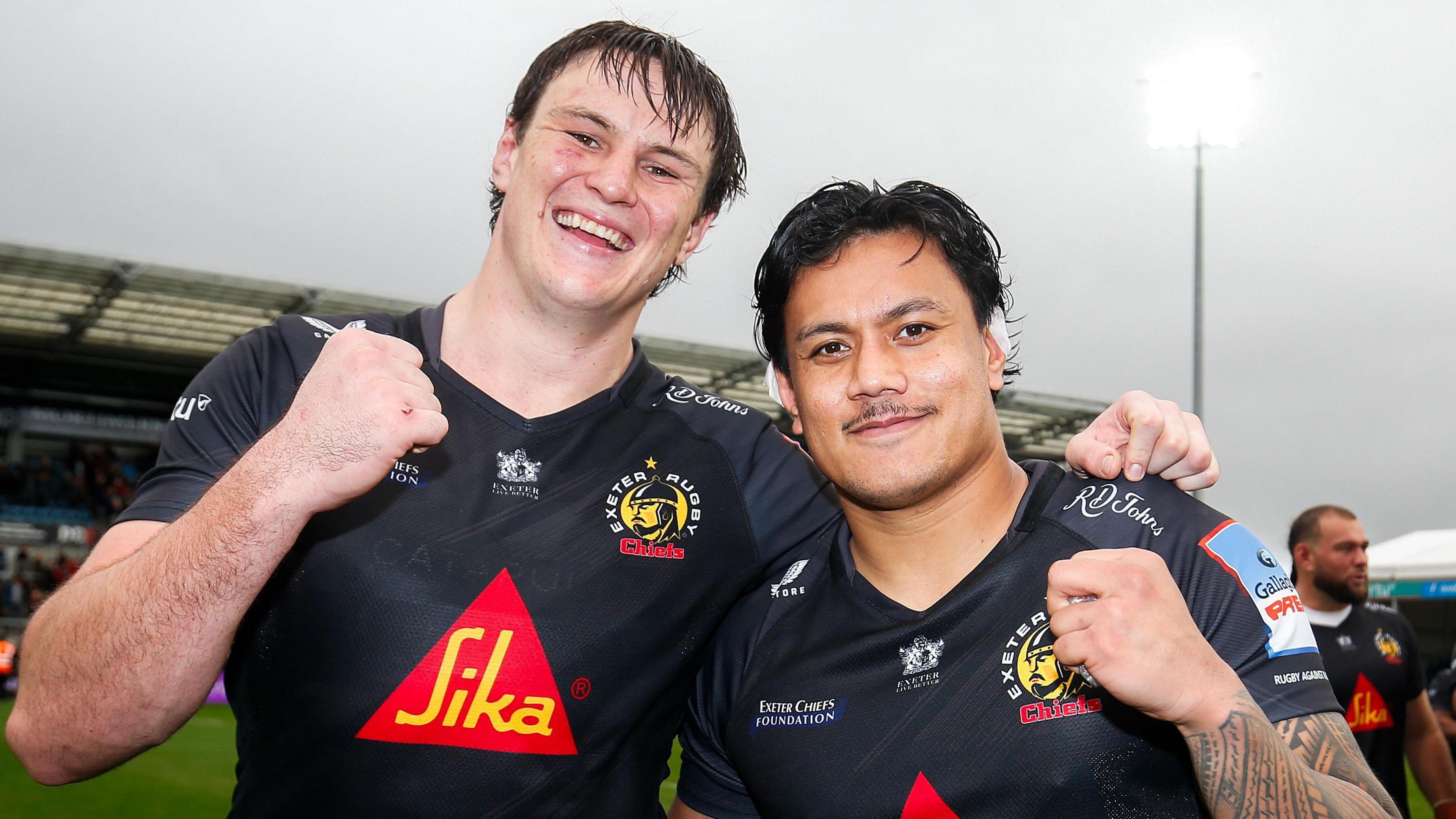 Tom Hooper and Len Ikitau pose after a game