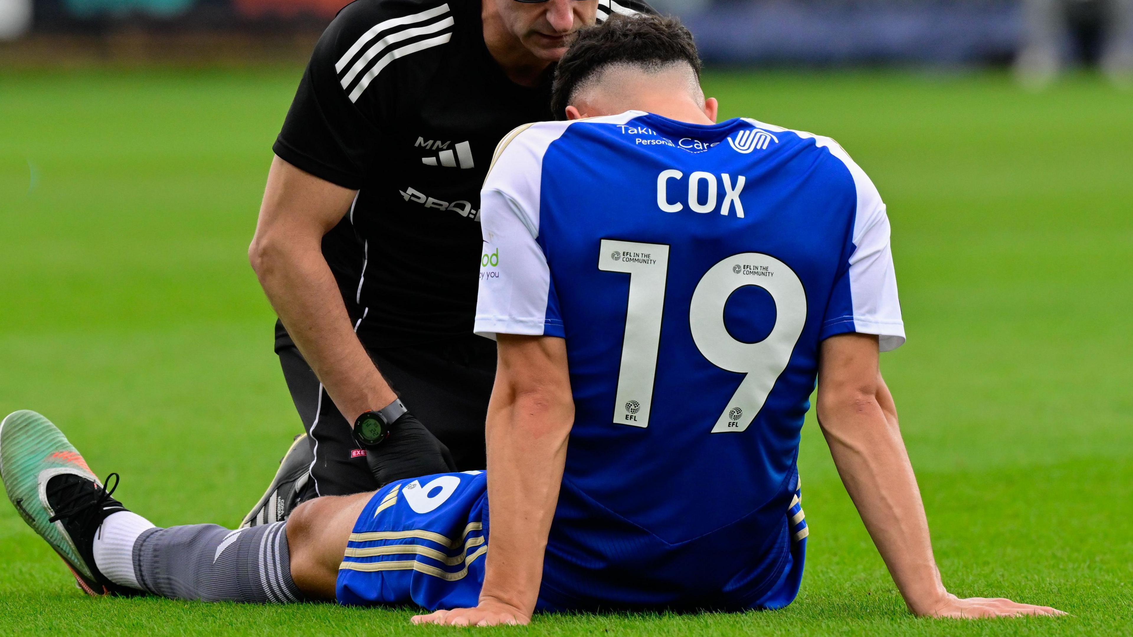 Sonny Cox gets treatment after being injured