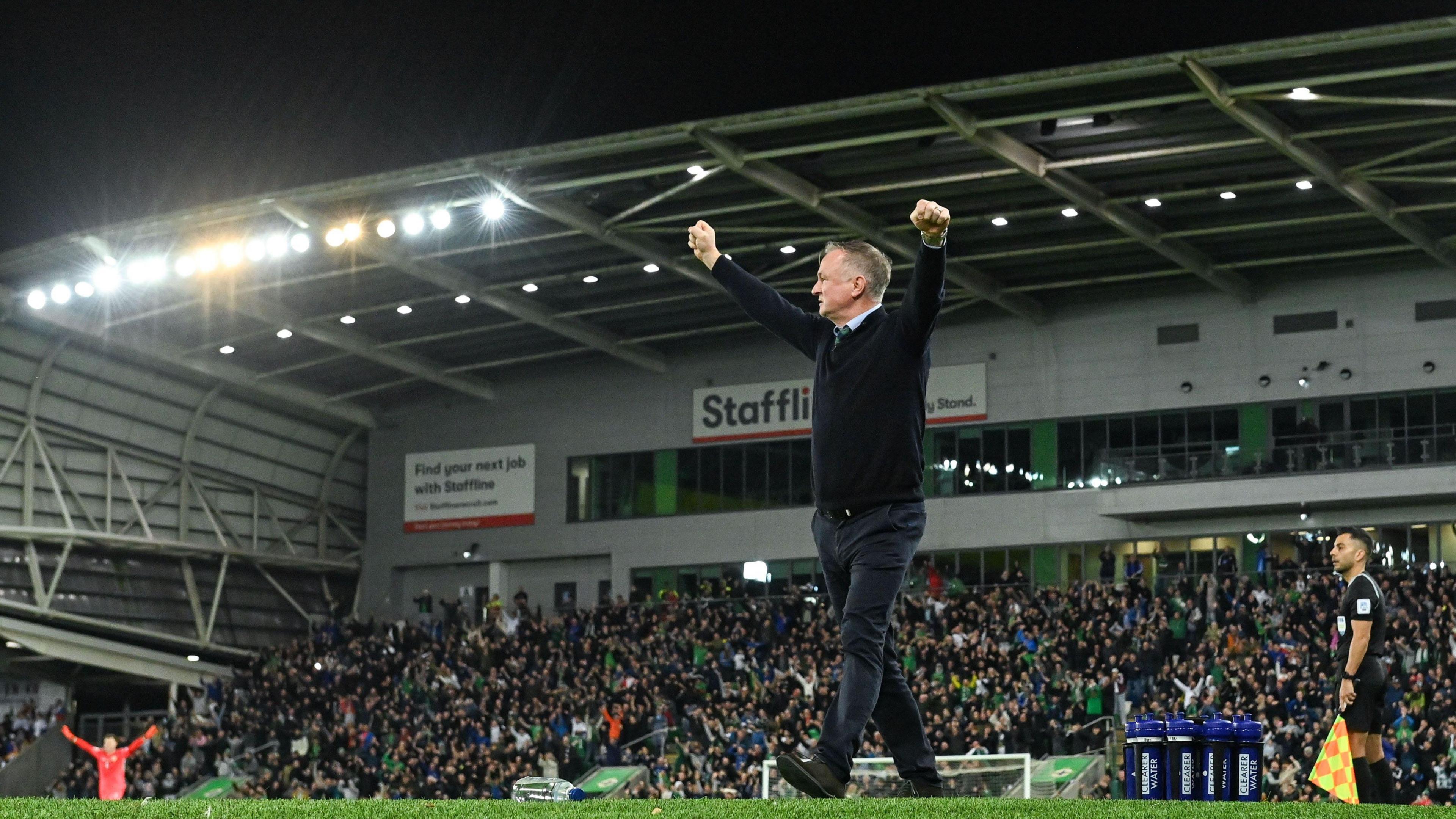 Michael O'Neill celebrates Trai Hume's goal