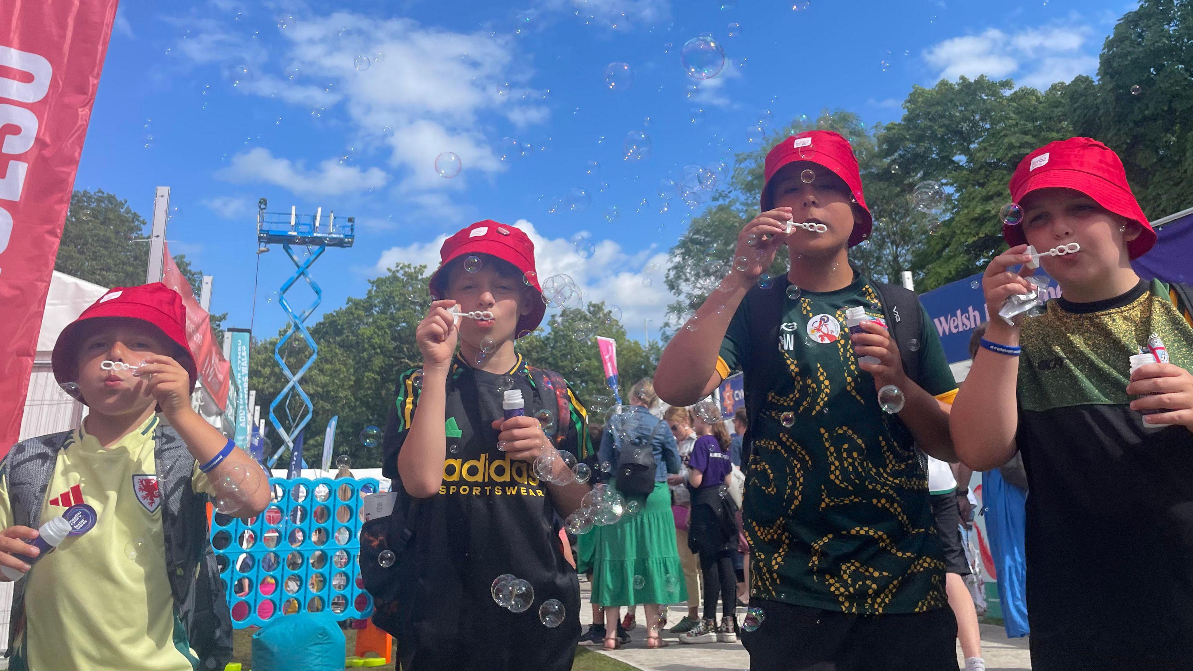  Ethan, Josh, Jack, and Aled blowing bubbles