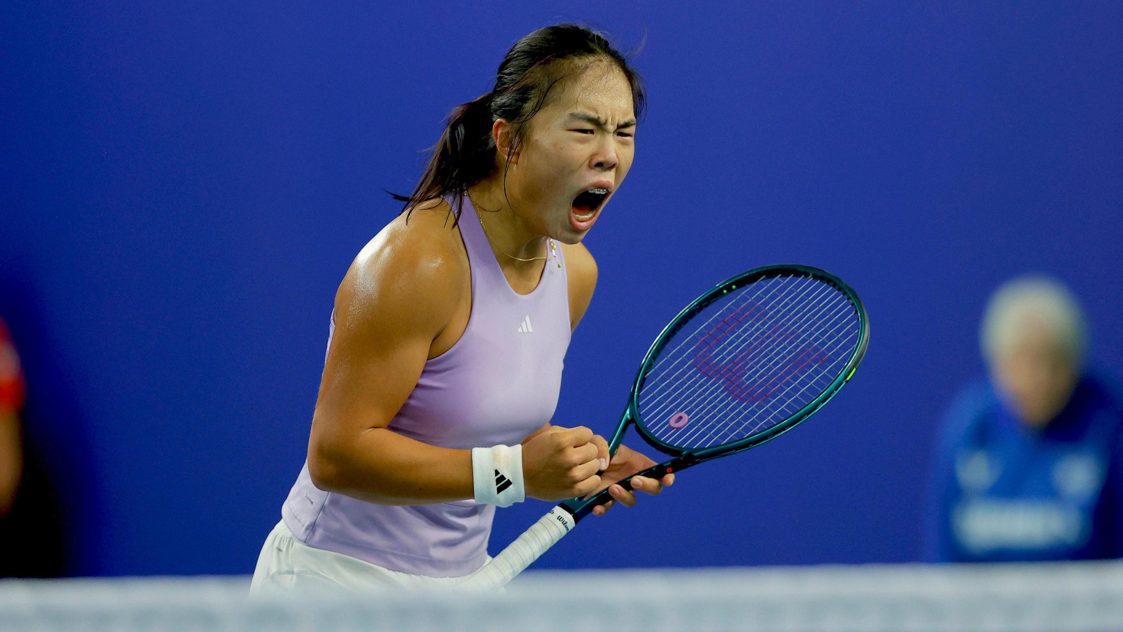 Mimi Xu celebrates after winning a point