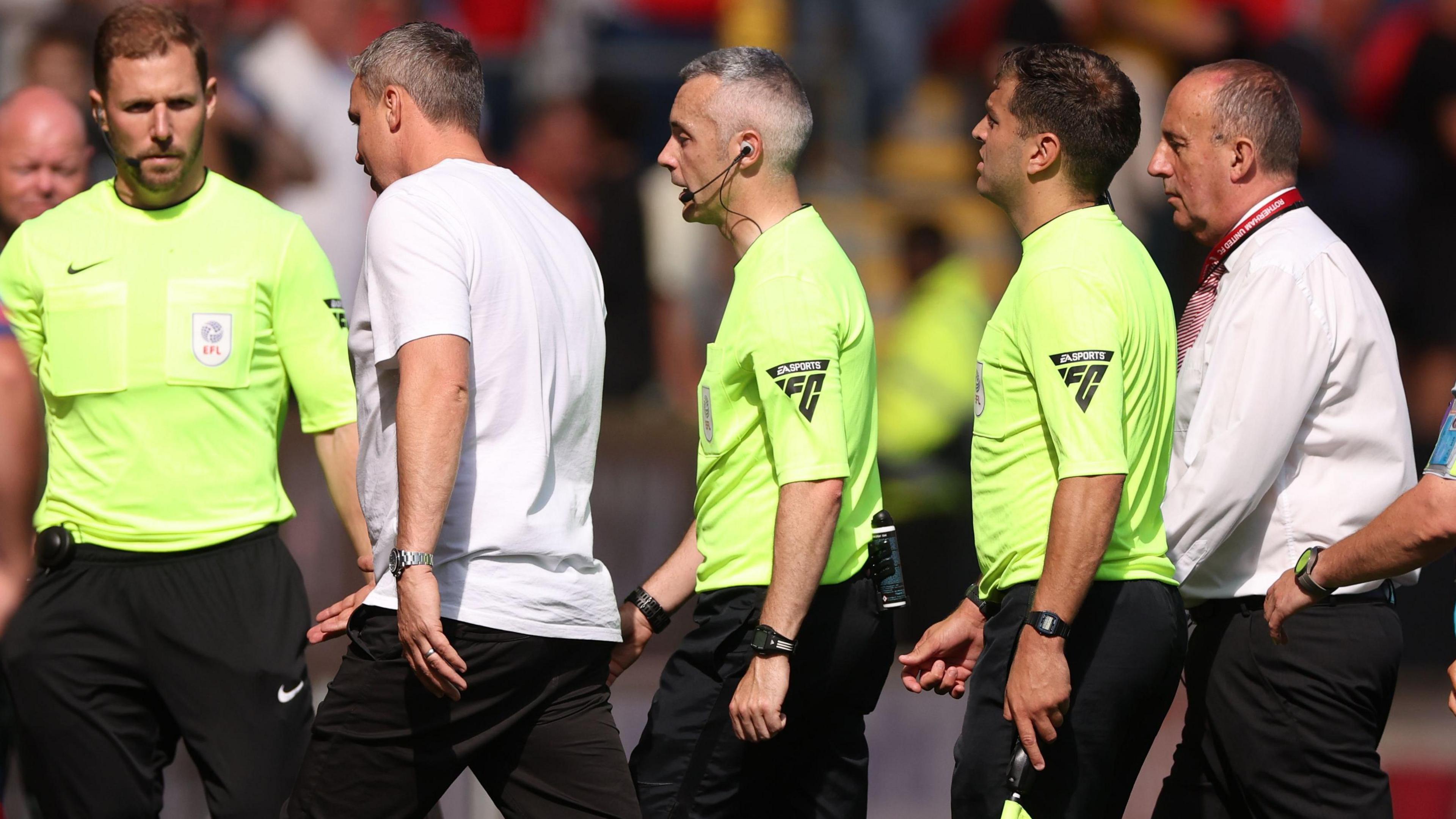 Rotherham United v Huddersfield Town, EFL Sky Bet League One, Football, AESSEAL New York Stadium, Rotherham, UK, 31 Aug 2024
Michael Duff Manager of Huddersfield Town talks to Referee Mr Seb Stockbridge as he leaves the pitch.