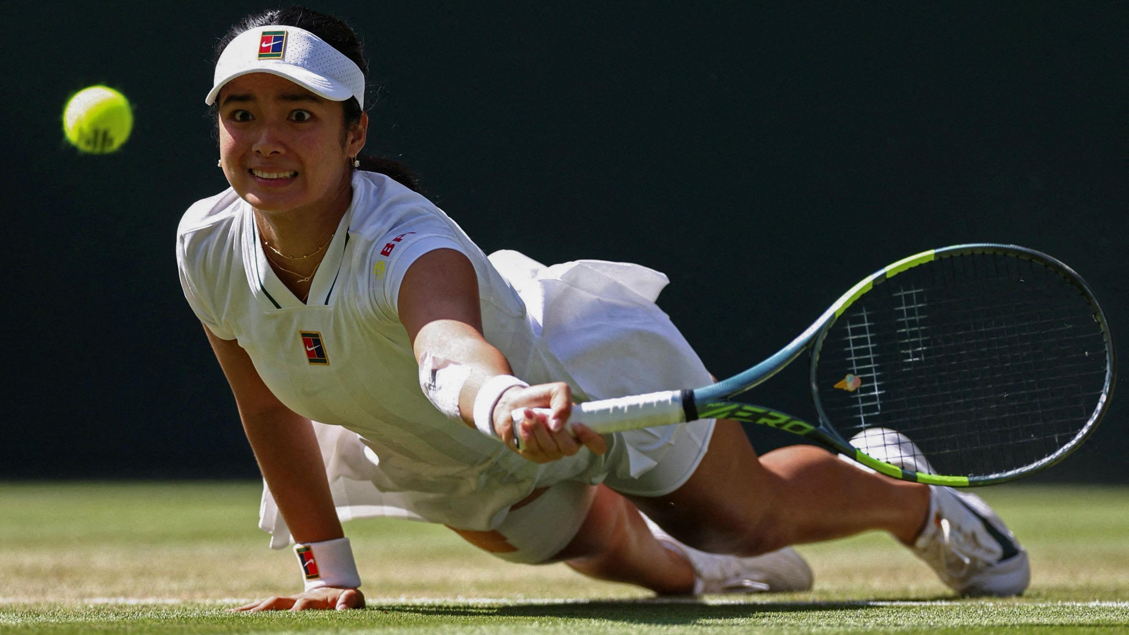 Eala dives stretching for ball with raquet
