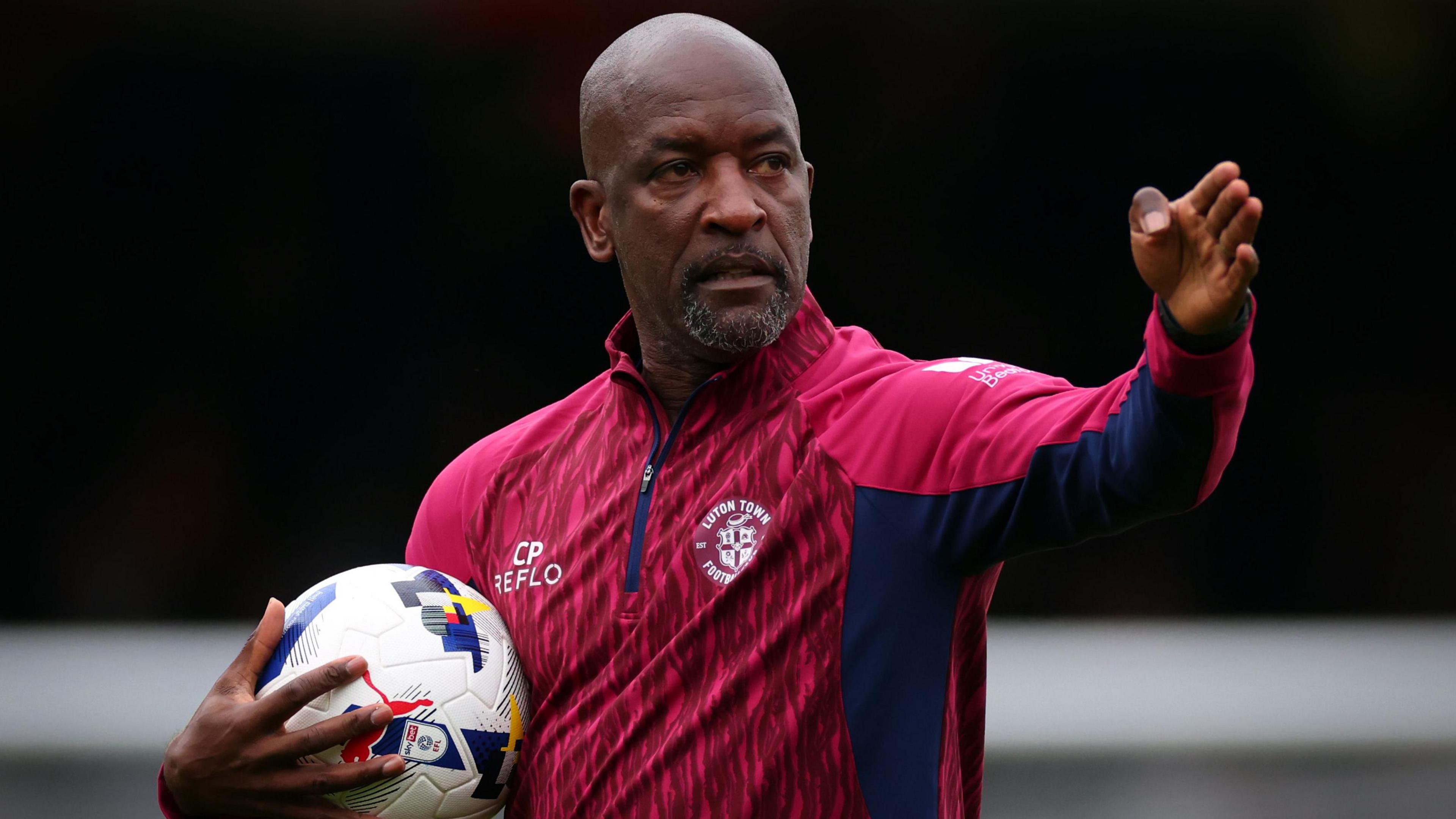 Chris Powell looks on during training