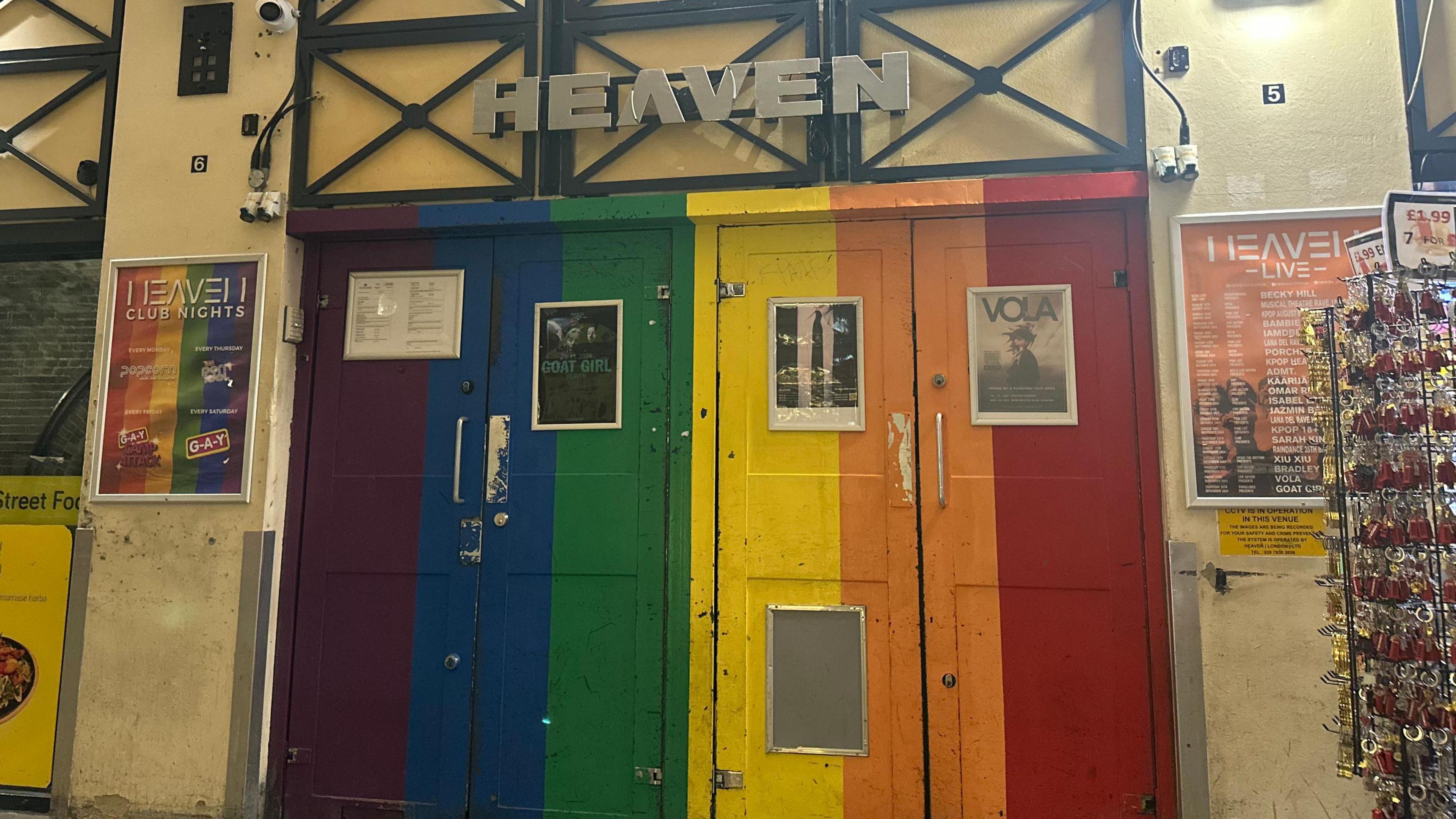 The Pride-themed doors of Heaven - the two doors are coloured purple, blue, green, yellow, orange and red.