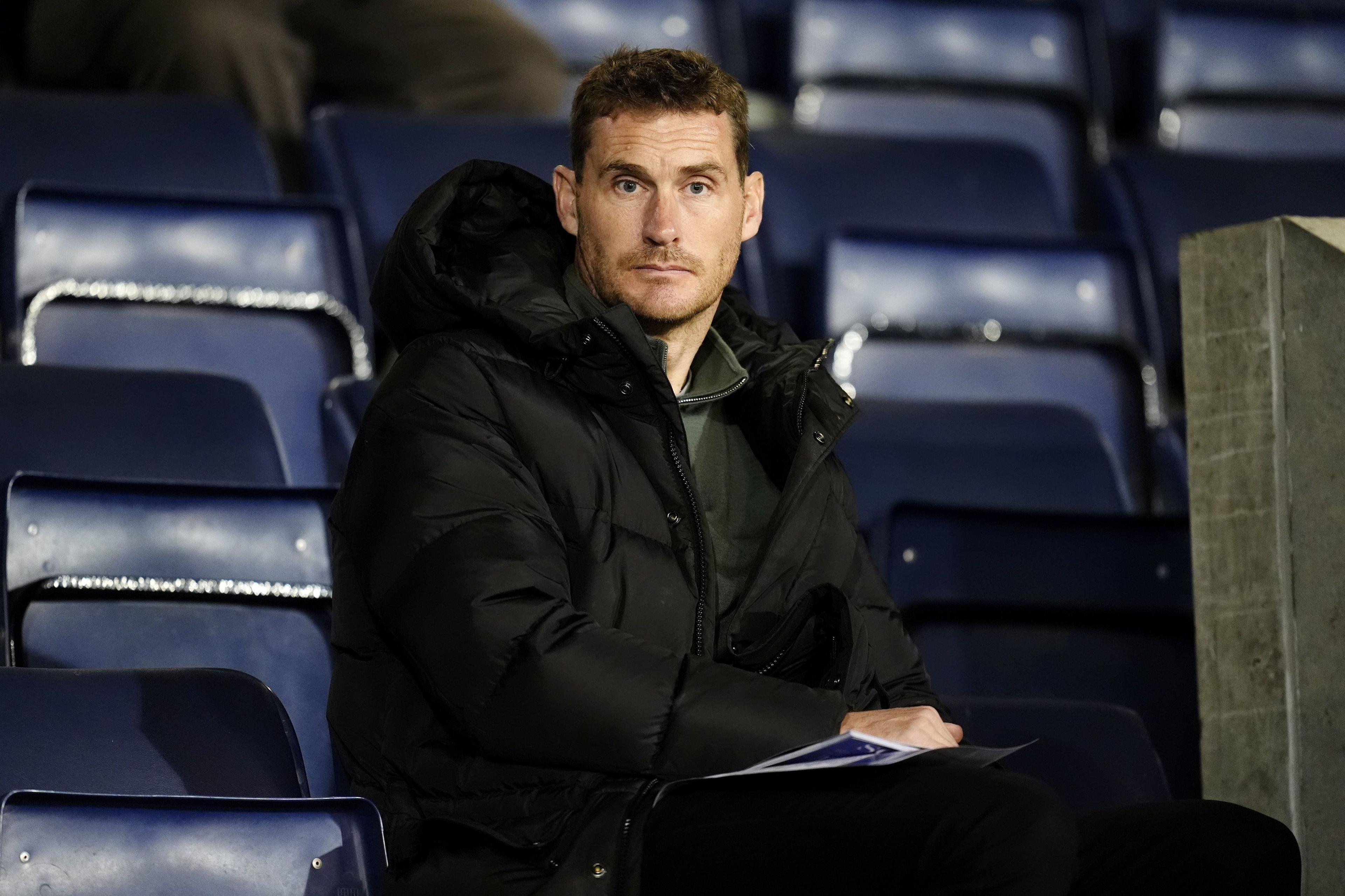 Former Bristol Rovers manager Matt Taylor sits in the stands