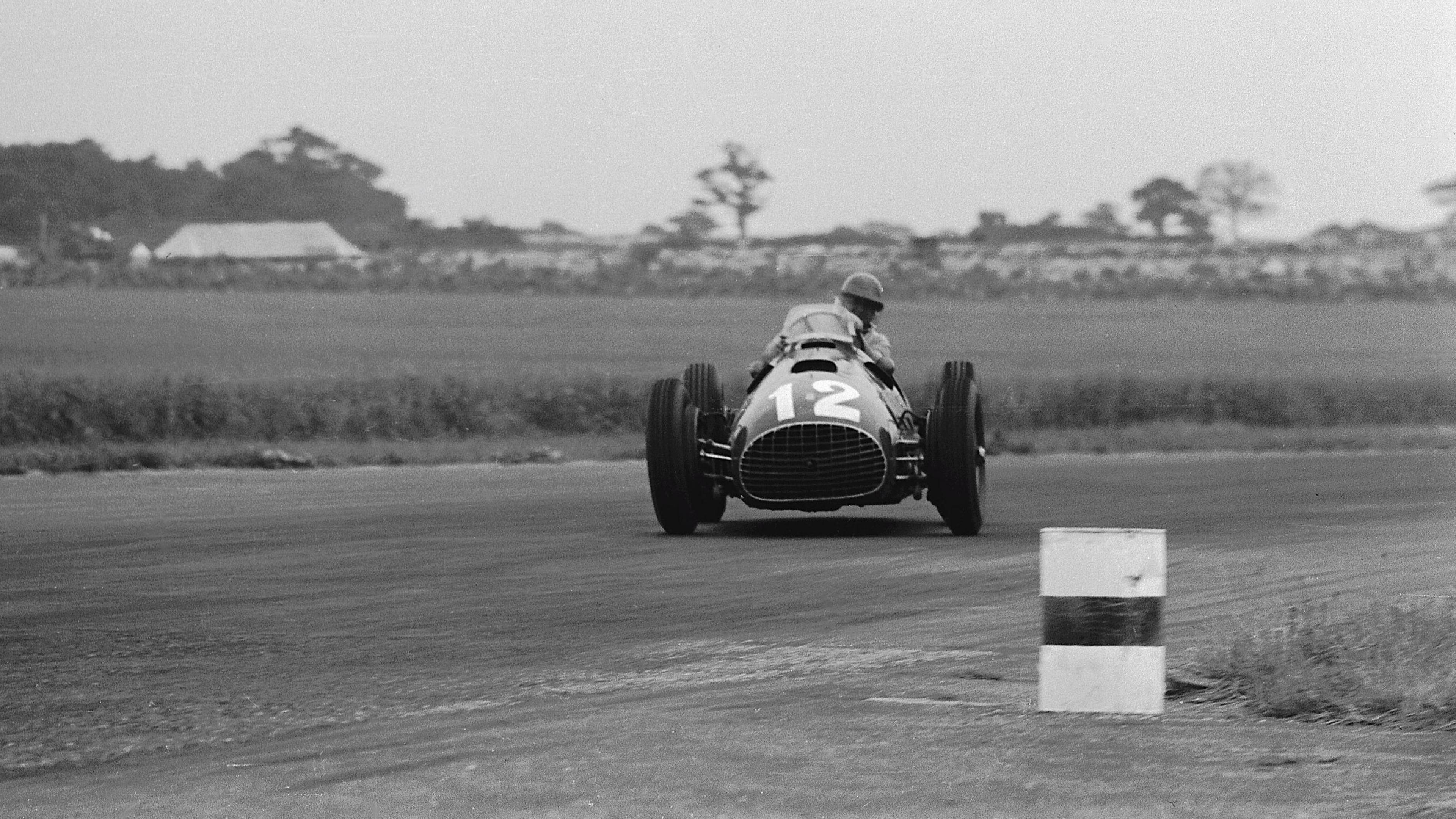 Jose Froilan Gonzalez all crossed up at about 140 mph through Abbey Curve on his way to victory in the 1951 British Grand Prix