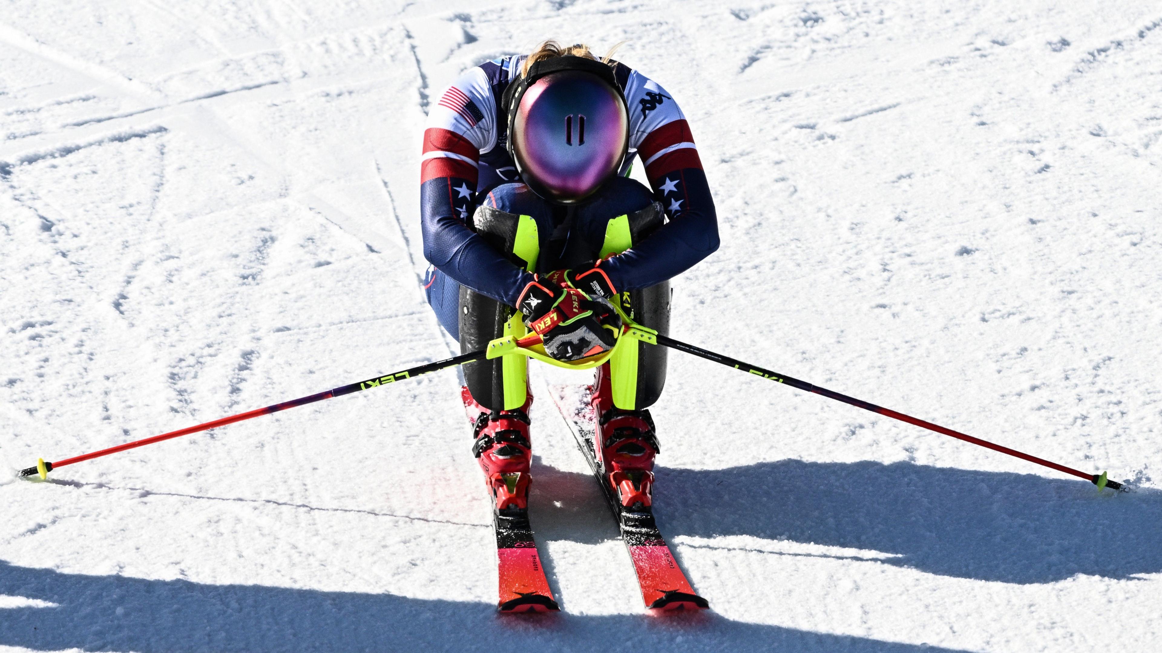 Mikaela Shiffrin crouches on skis after winning Olympic gold in slalom in Cortina