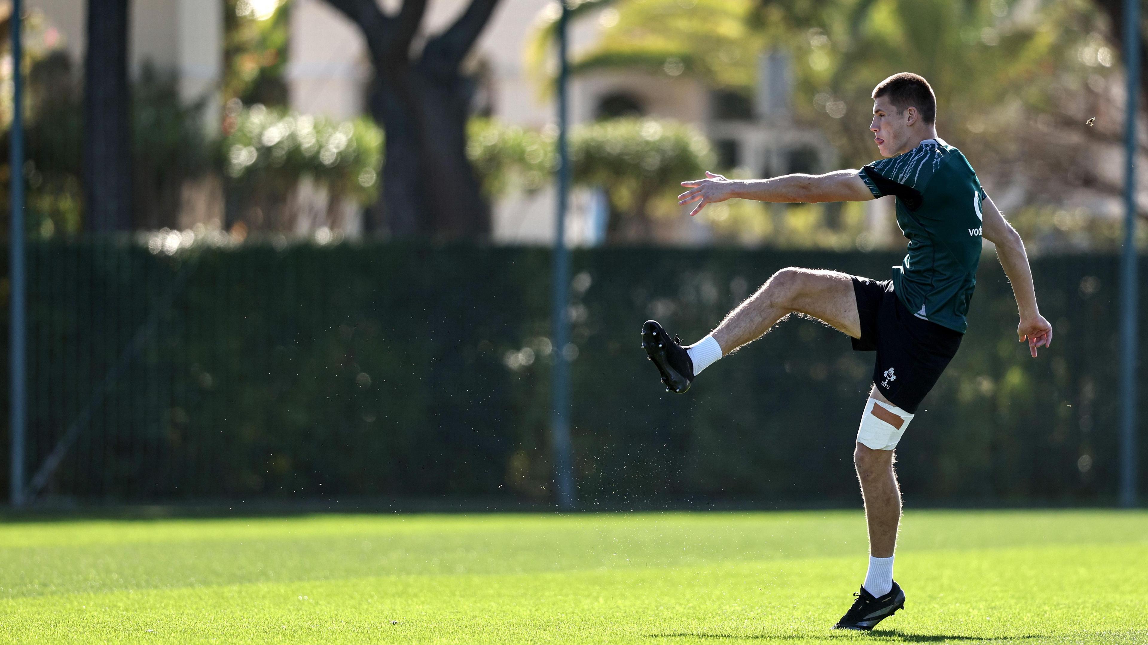 Ireland fly-half Sam Prendergast trains in Portugal with strapping on his leg