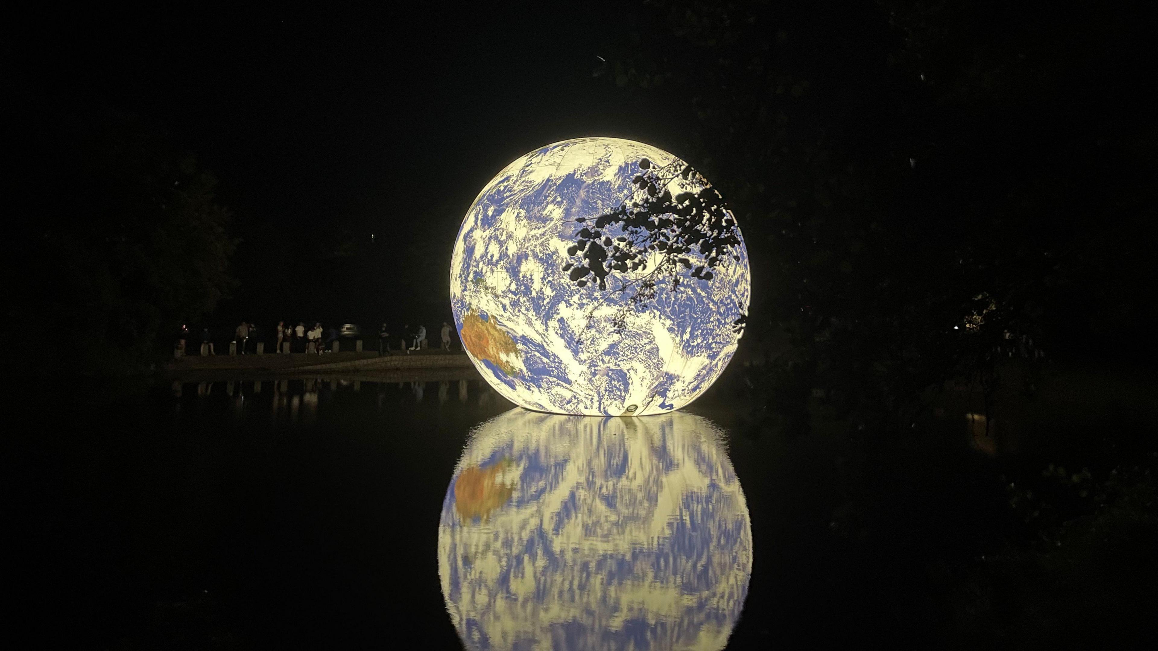 Floating globe on reservoir in Jersey